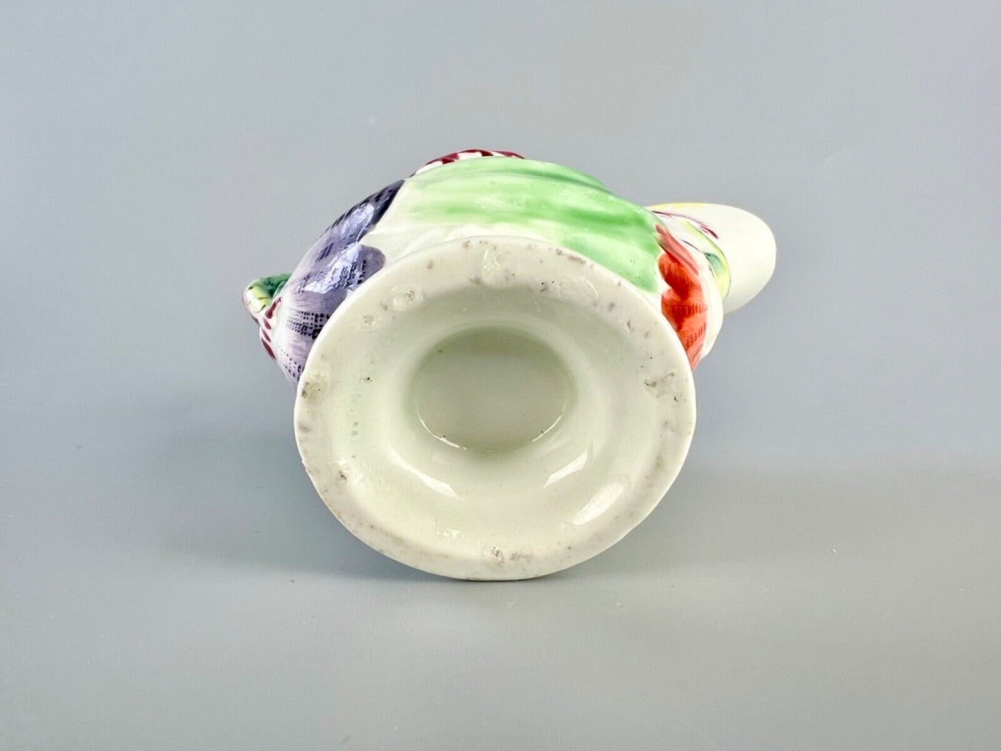 A c.1765 Worcester lamprey-handled dolphin-ewer creamer. Polychrome decoration.