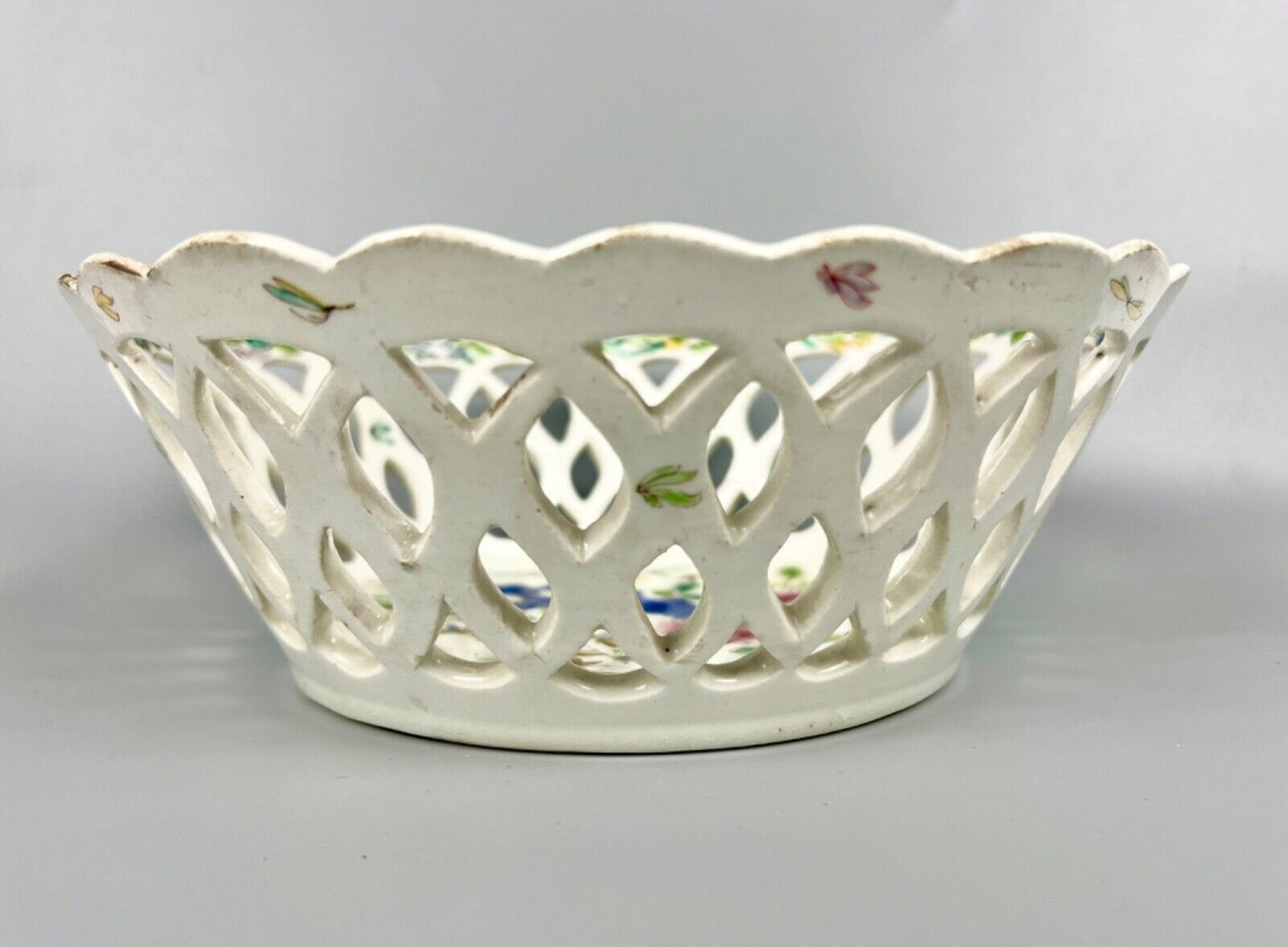 A pair of large Bow porcelain famille rose reticulated baskets c.1752