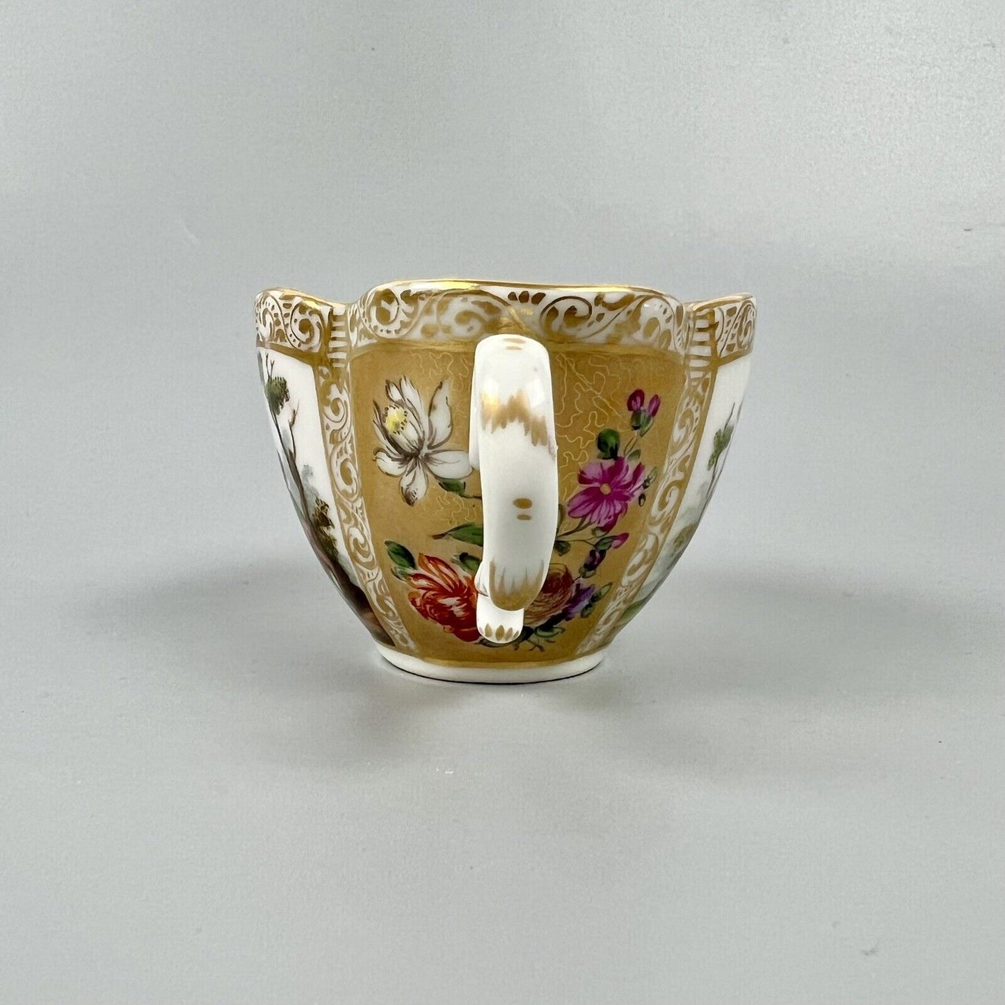 Dresden quatrefoil teacup & saucer painted with romantic scenes. 'AR' mark c1880