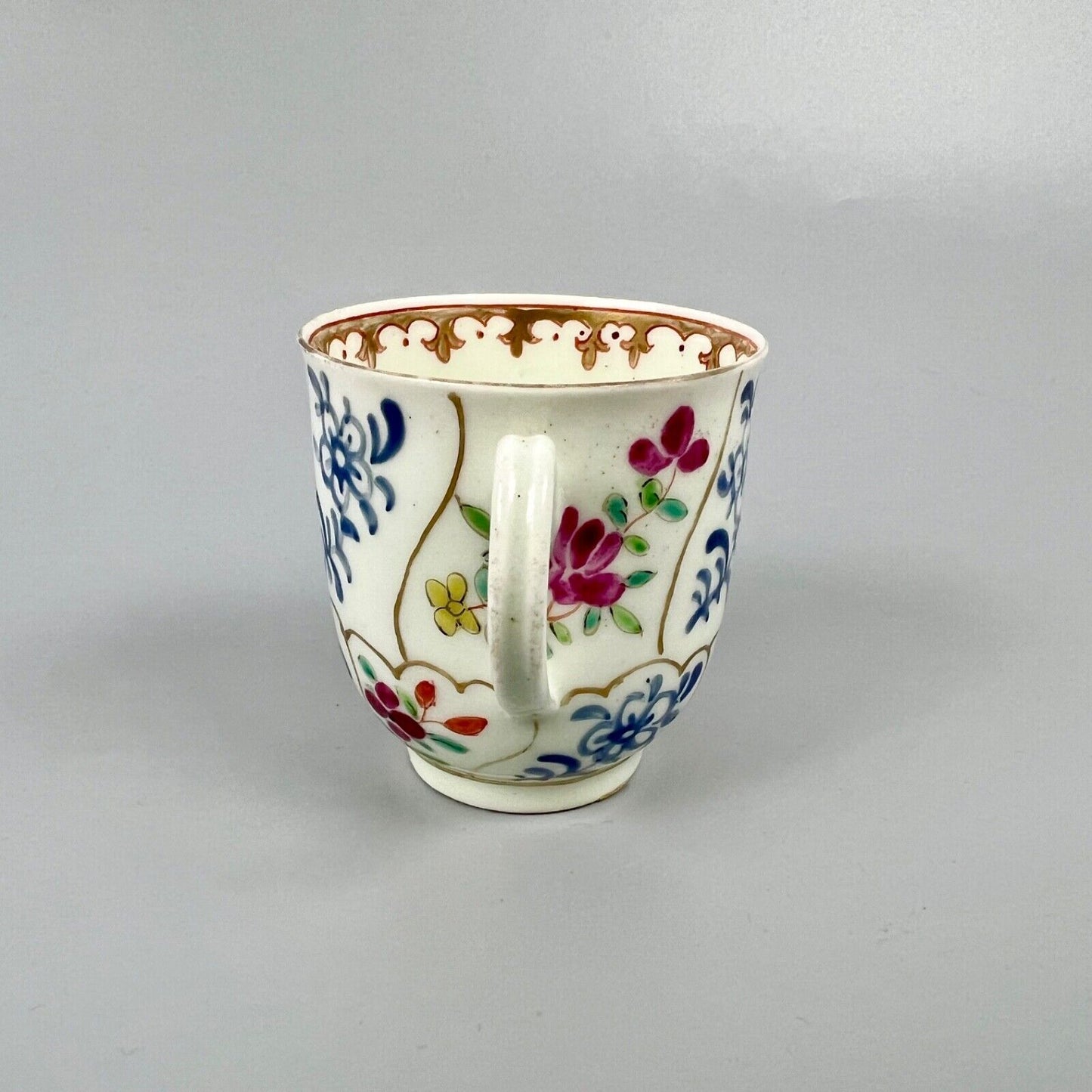 1st Period Worcester outside decorated coffee cup. Gilt trellis inner rim. c1770
