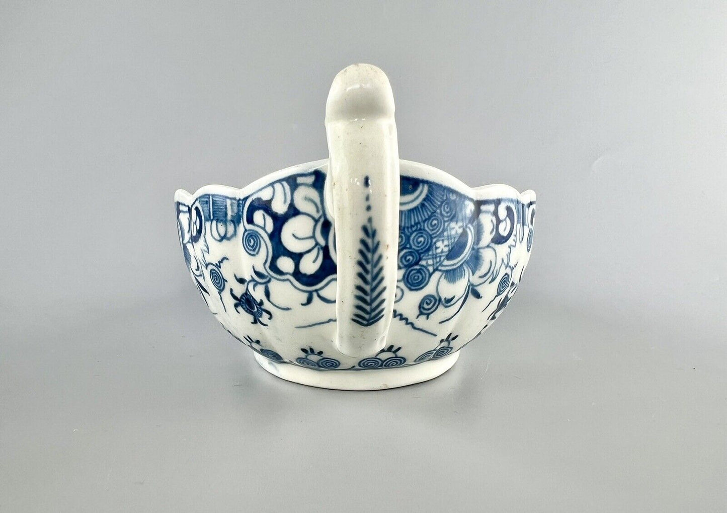 A Worcester First Period "Doughnut Tree" sauceboat. c.1777