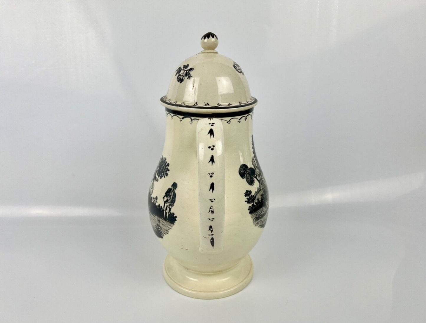 A very tall pearlware "Tea Party" pattern coffee pot c 1790. Prpbably Staffs.