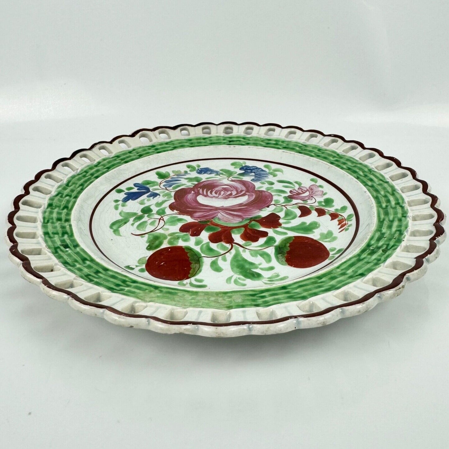 A Glamorgan Pottery, Swansea, reticulated and hand-painted plate c.1814-20