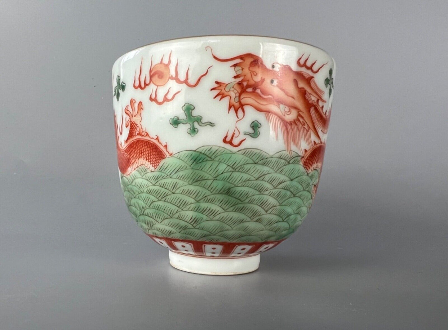 A 20thc Chinese porcelain painted bowl, depicting the dragon & flaming pearl.