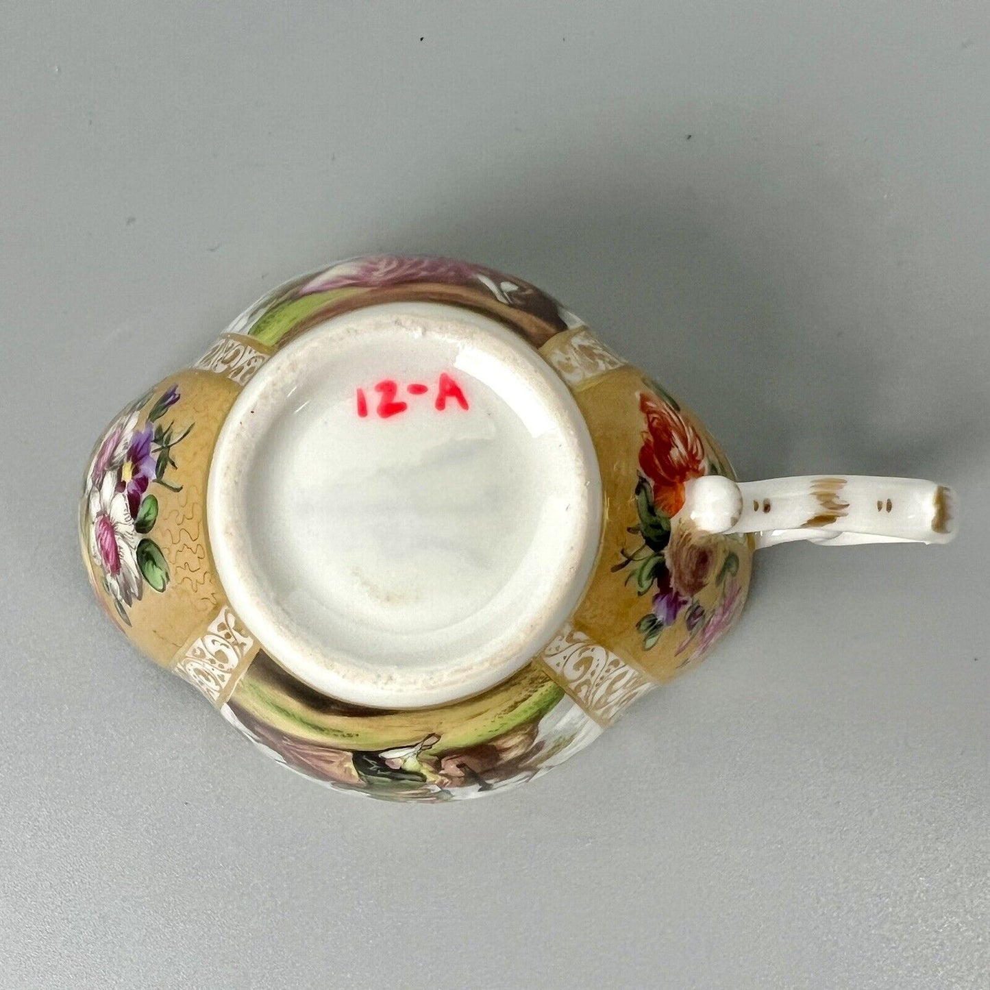 Dresden quatrefoil teacup & saucer painted with romantic scenes. 'AR' mark c1880