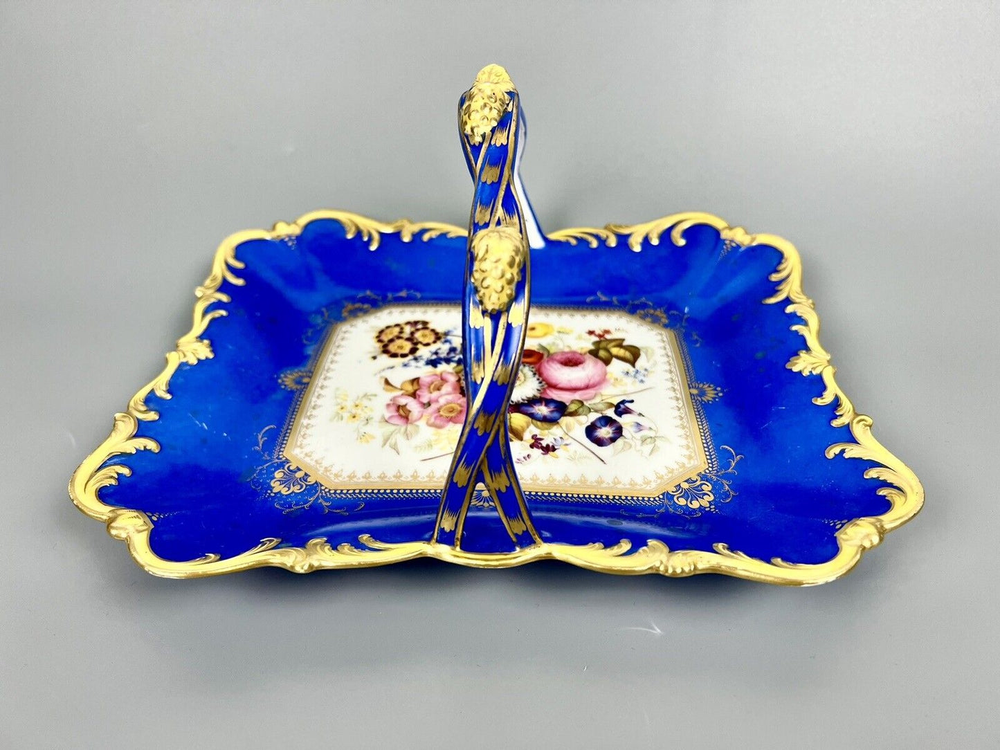 A lovely Samuel Alcock fruit basket finely painted with garden flowers. c.1830