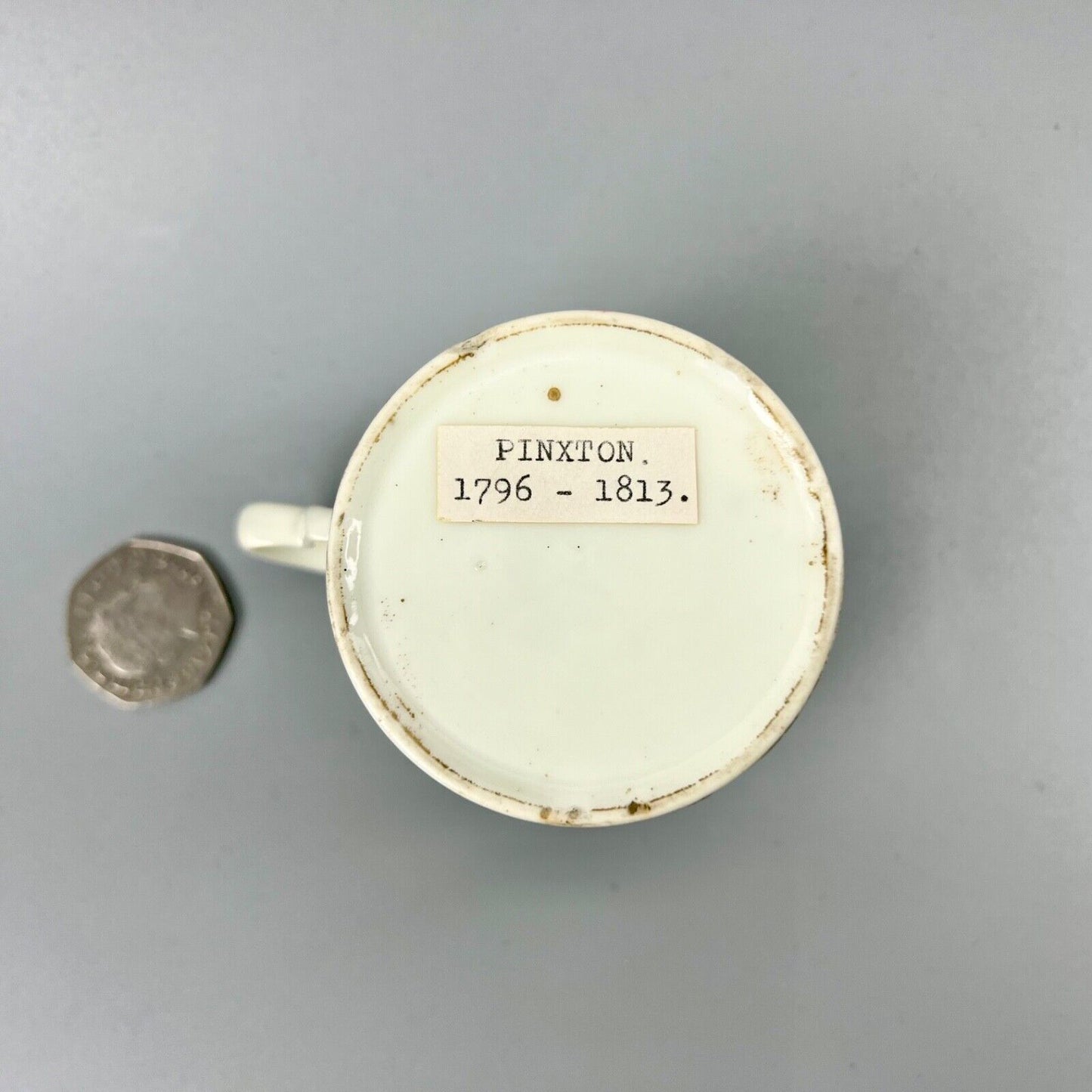 A Pinxton pattern one coffee can painted with Barbeaux Sprigs c1800