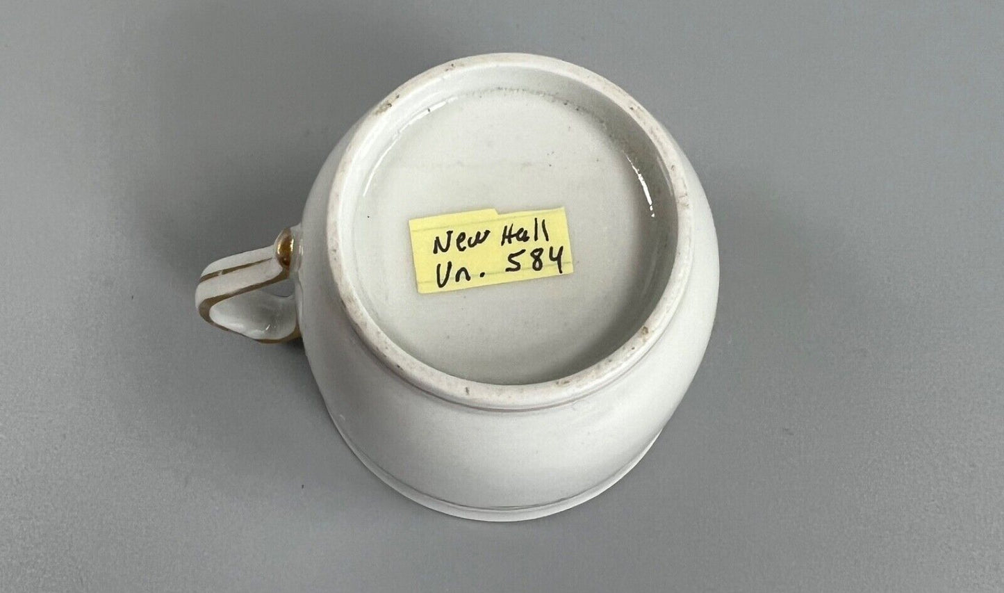 A c.1787-95 New Hall clip handle cup and saucer in pattern number 170