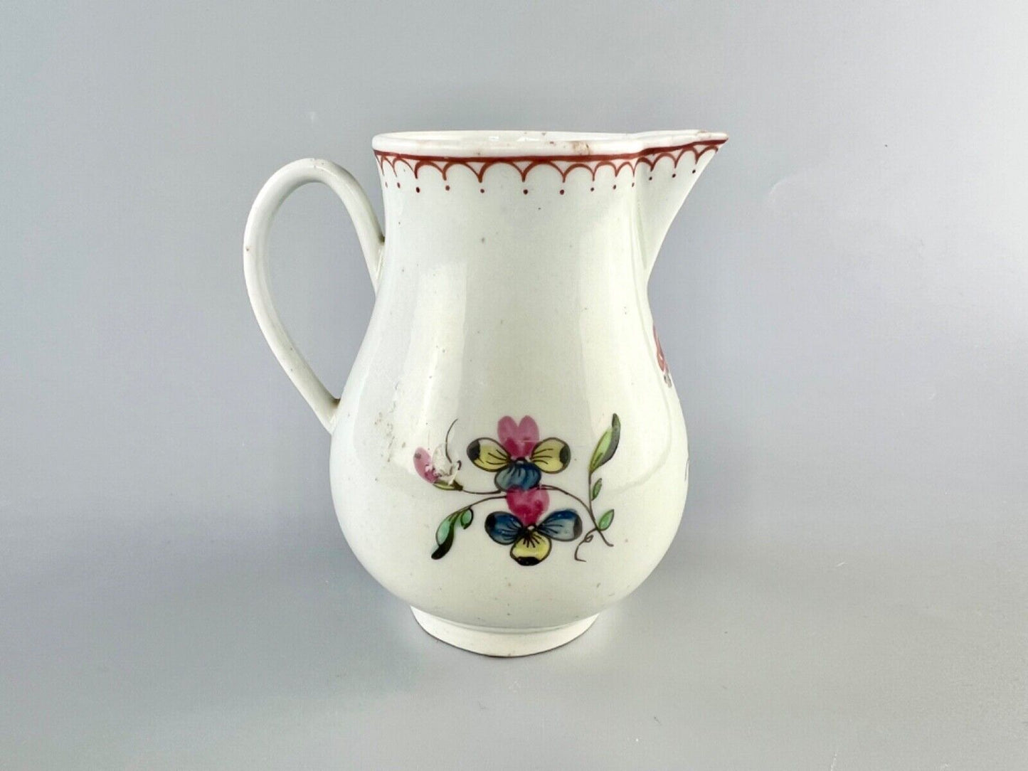 A Philip Christian Liverpool floral-decorated sparrowbeak jug. c.1770