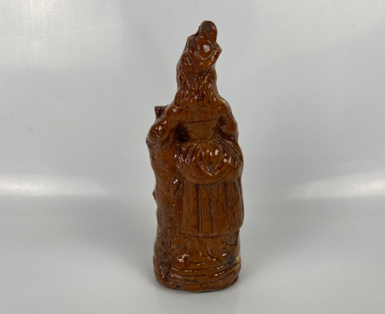 A cream dot decorated slipware figure of a woman on a treacle ground c1835