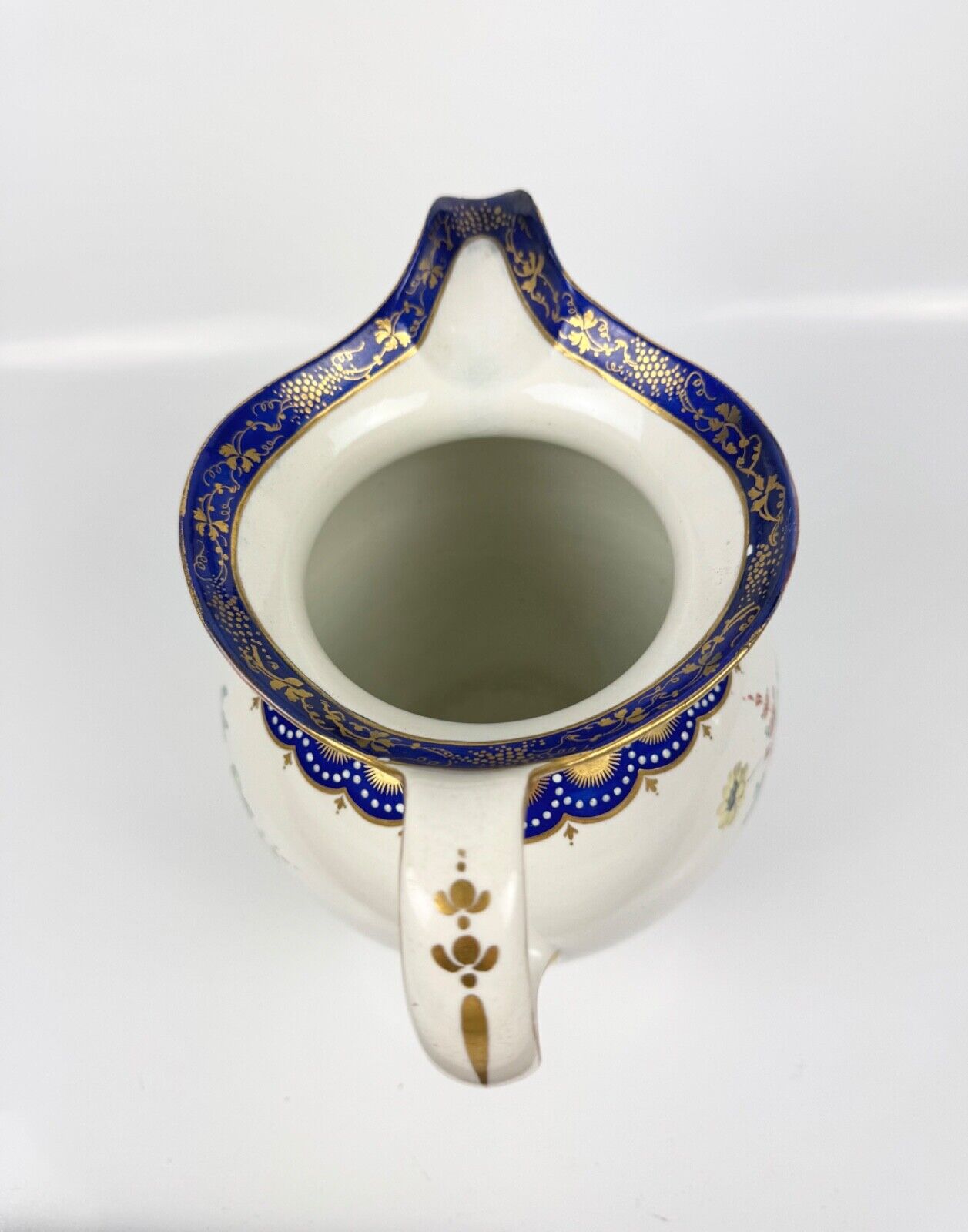 A rare Derby ewer Smith's blue rim and painted with flowers by Withers. c.1780