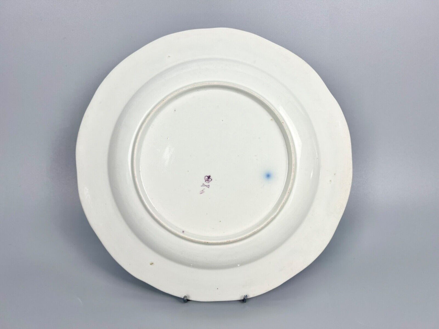 A very rare Derby plate 1785-90 painted as a replacement by William Billingsley