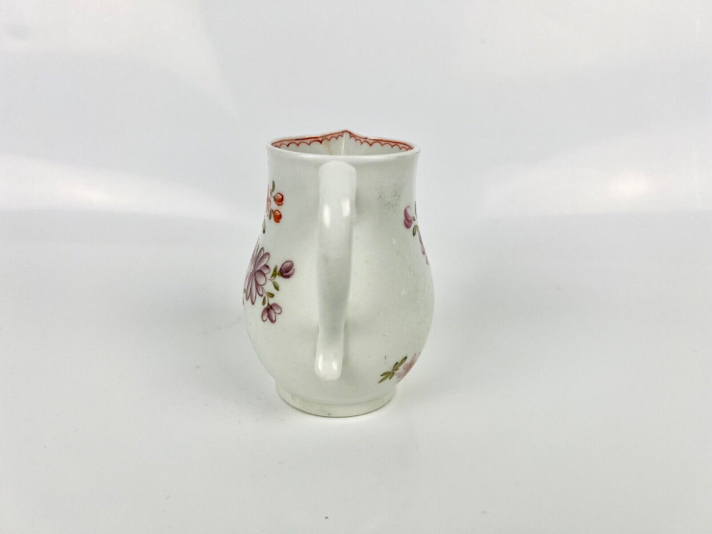 A Lowestoft 'Tulip Painter' creamer painted with floral sprays c.1775