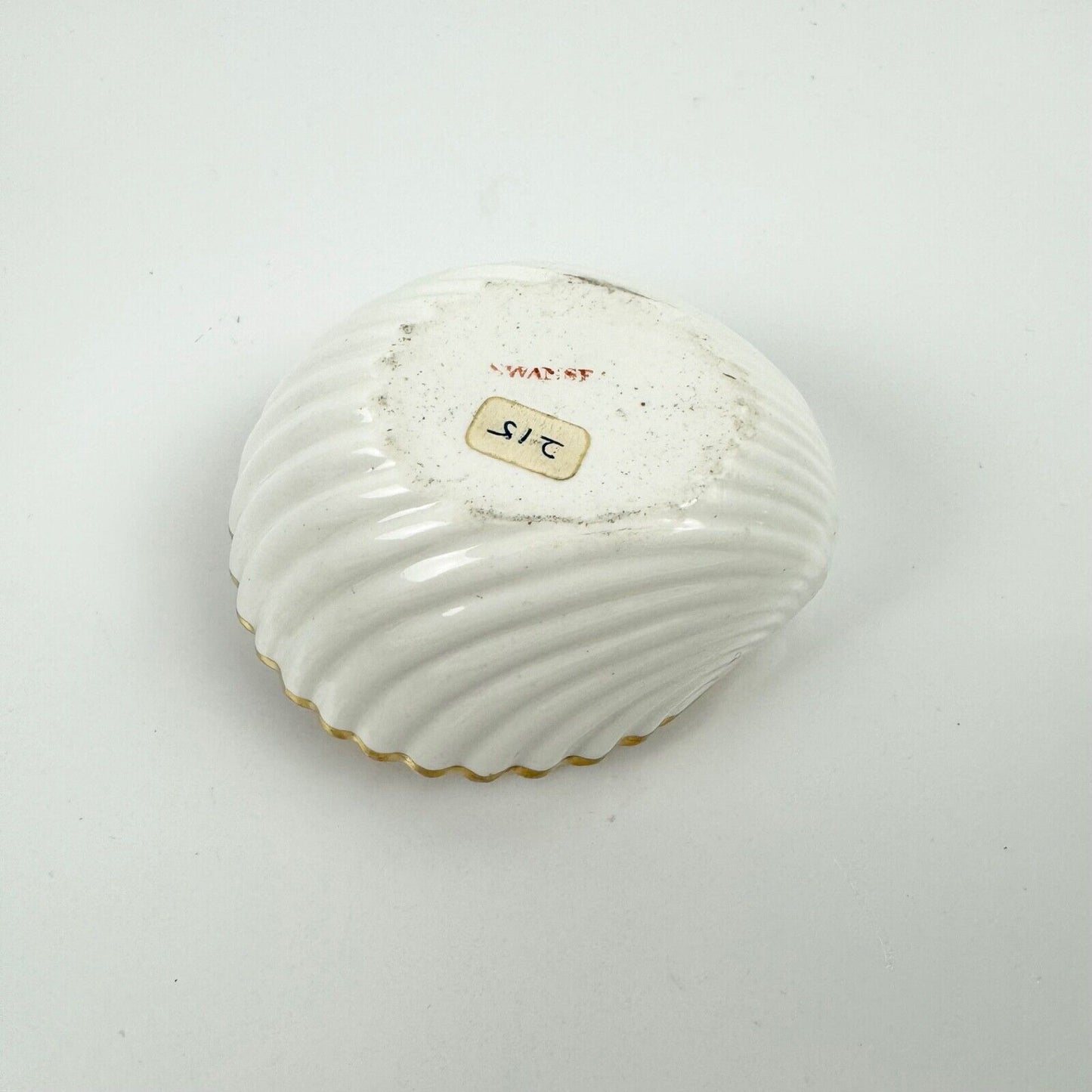 A fine shell-shaped Swansea inkwell and liner painted with roses c1814-26