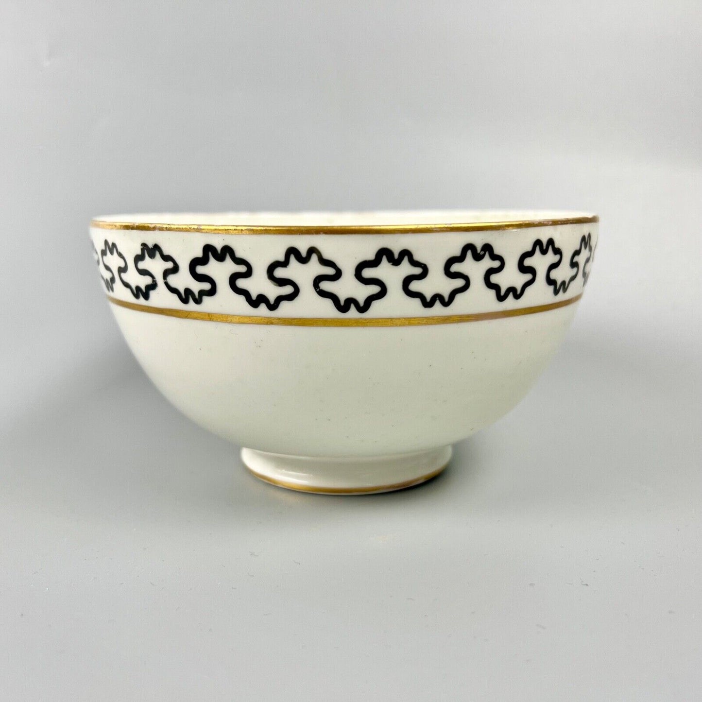 An unrecorded Pinxton slop bowl painted with a meandering black line. c.1810