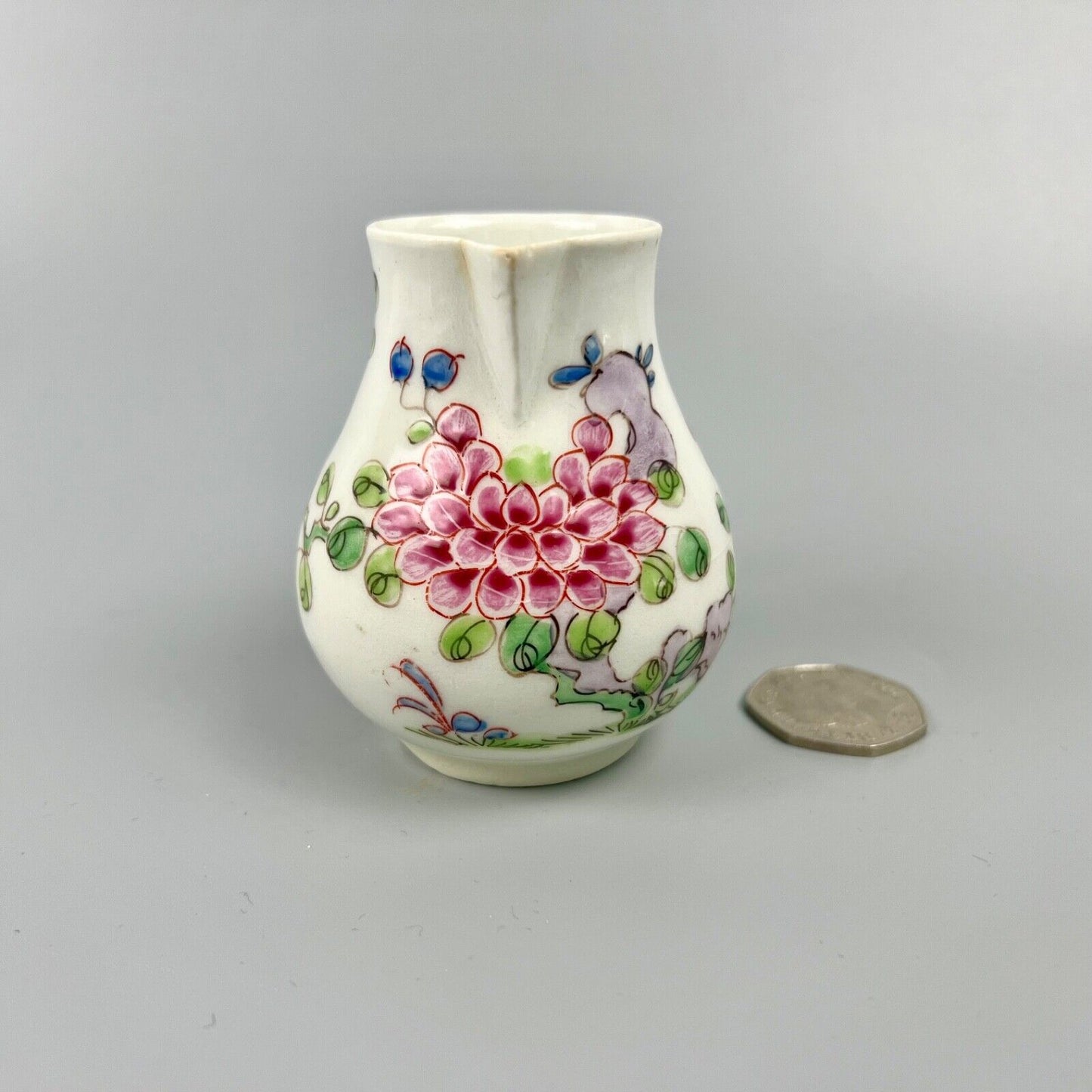 An early Bow creamer painted in famille rose style c1750-3
