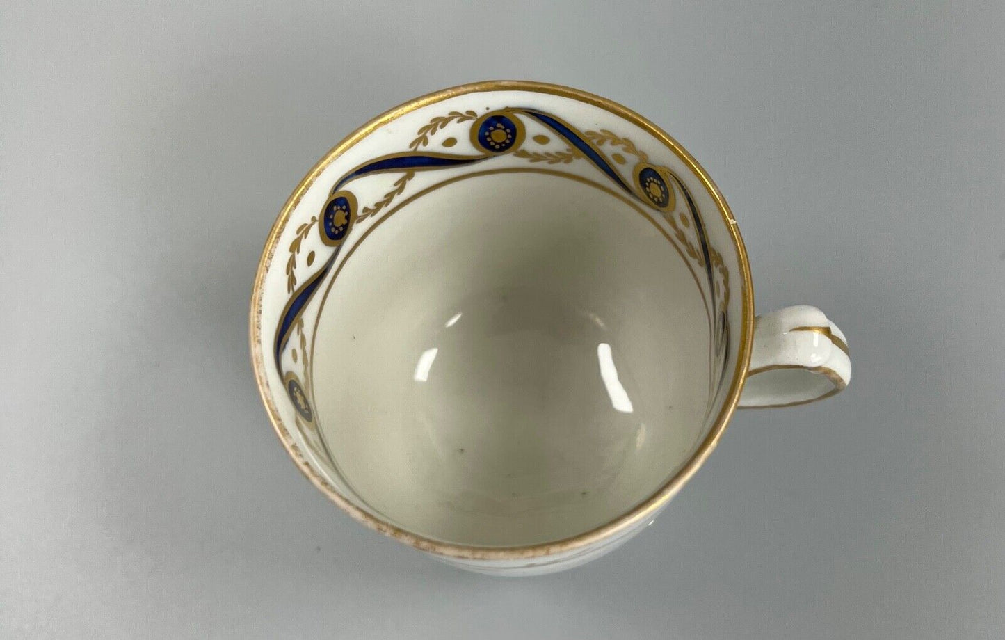 A c.1787-95 New Hall clip handle cup and saucer in pattern number 170