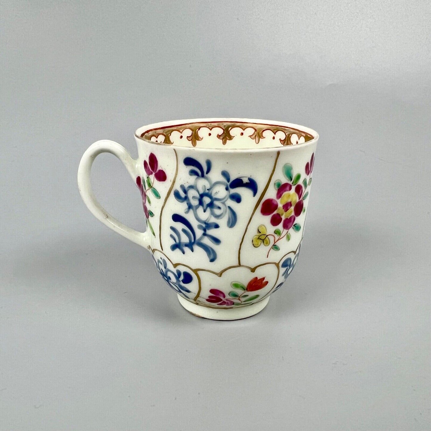 1st Period Worcester outside decorated coffee cup. Gilt trellis inner rim. c1770