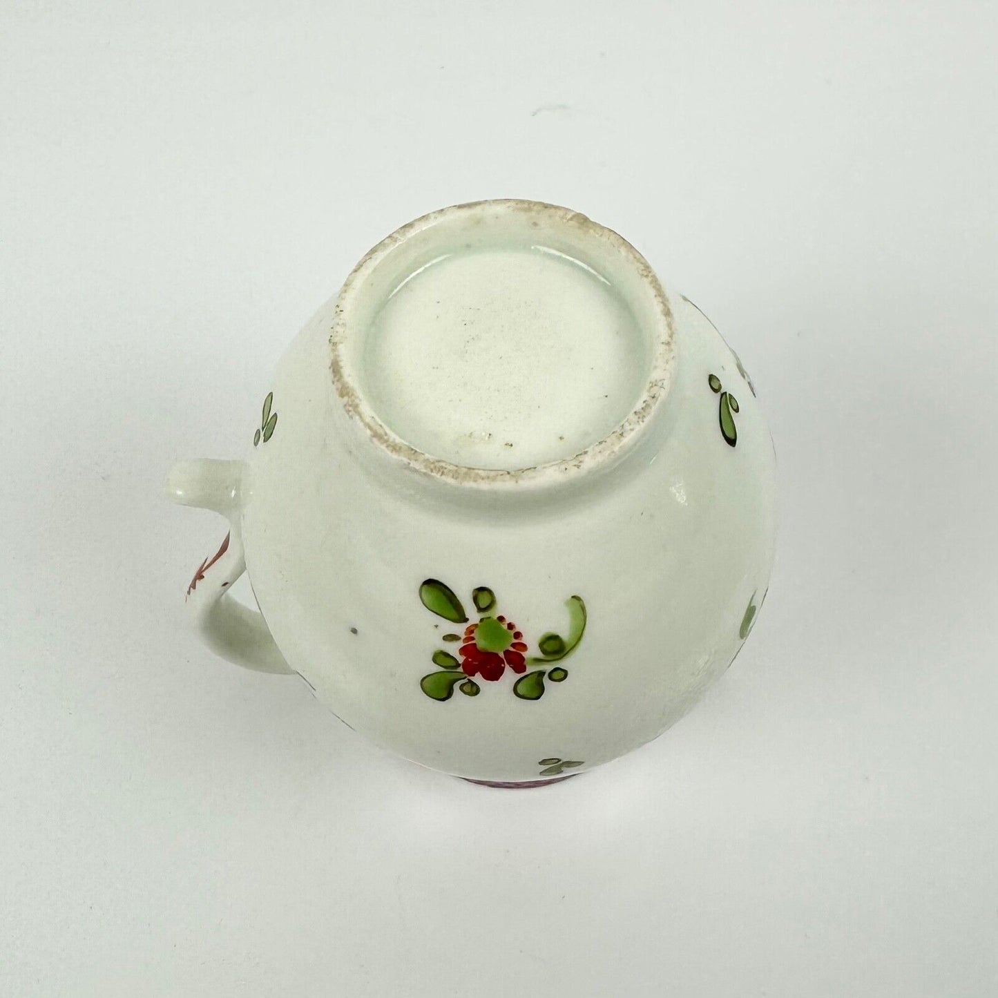 A Lowestoft sparrowbeak creamer c1775 painted with a Curtis style pattern