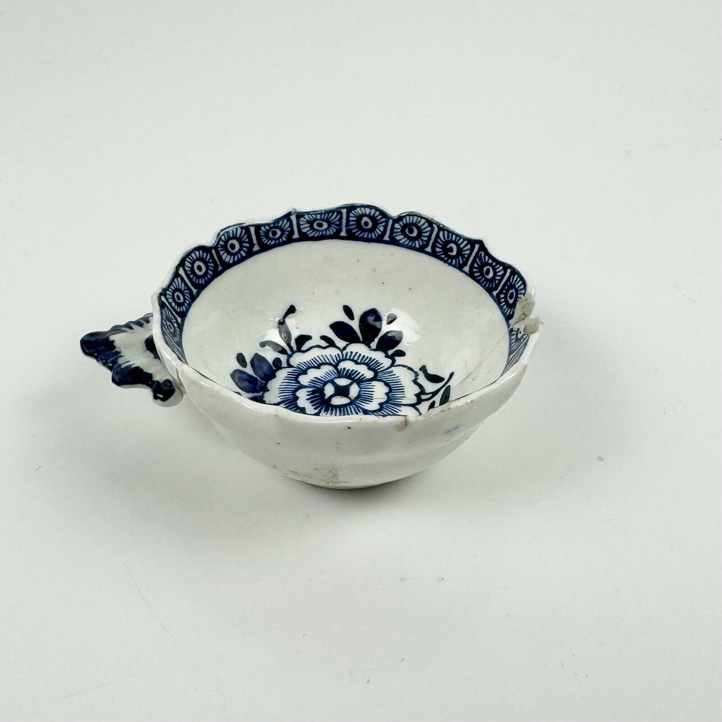 Unusual Derby wine tasters c1770 painted with blue carnations & cell border