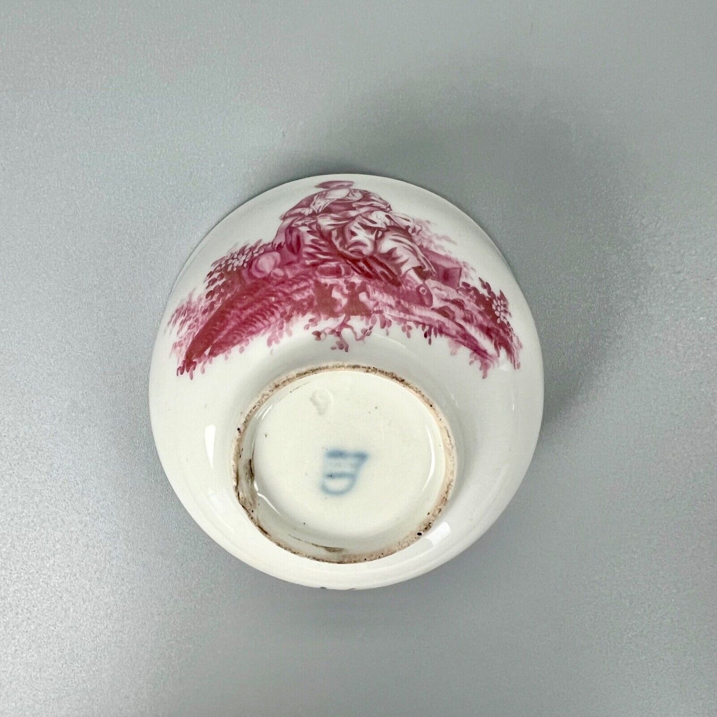 A Vienna porcelain teabowl painted with puce figures c1770-5