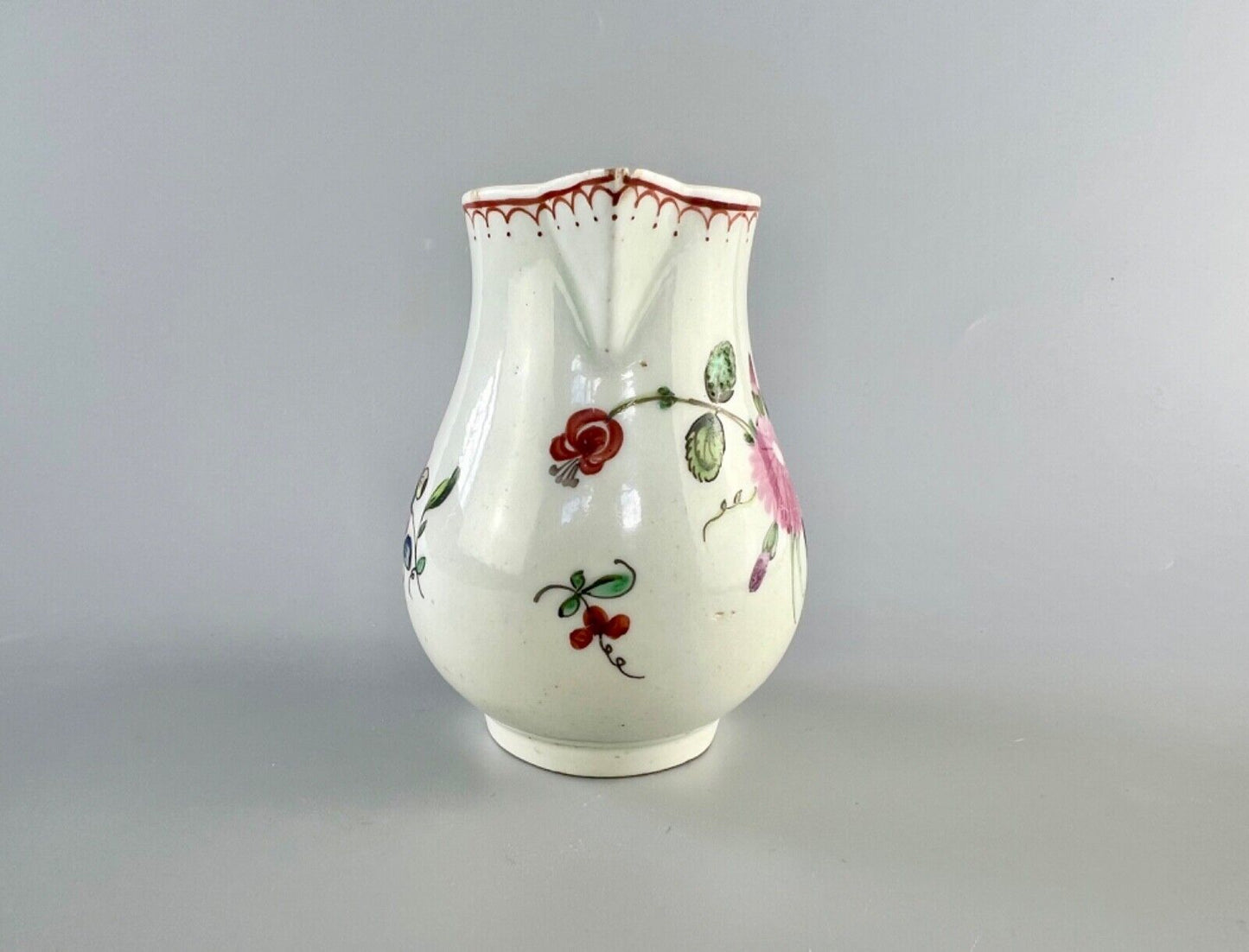 A Philip Christian Liverpool floral-decorated sparrowbeak jug. c.1770