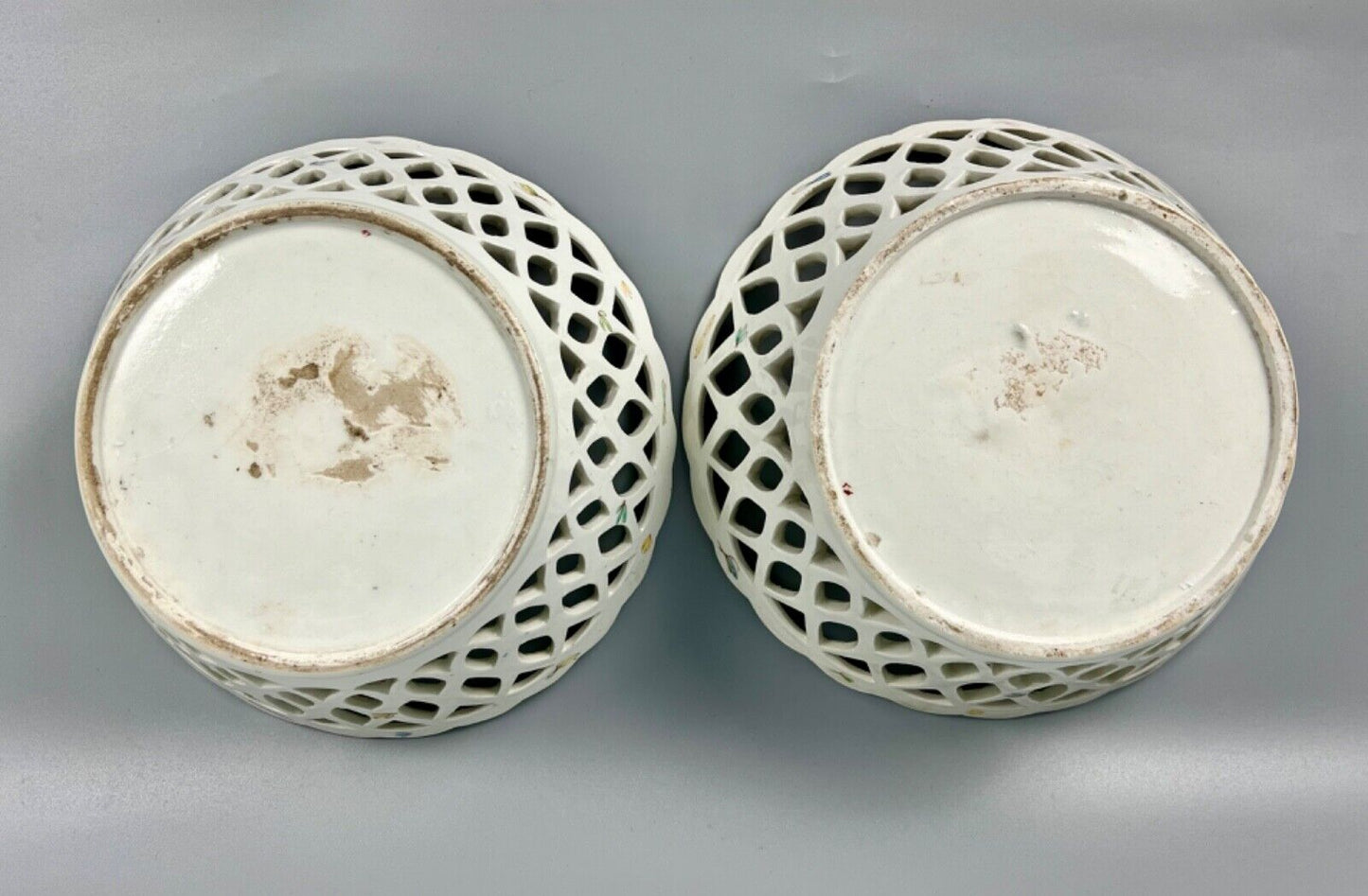 A pair of large Bow porcelain famille rose reticulated baskets c.1752