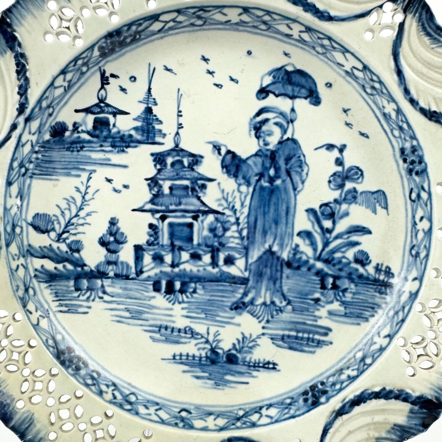 A fine pearlware reticulated plate painted with a 'Long Eliza' figure. c.1790