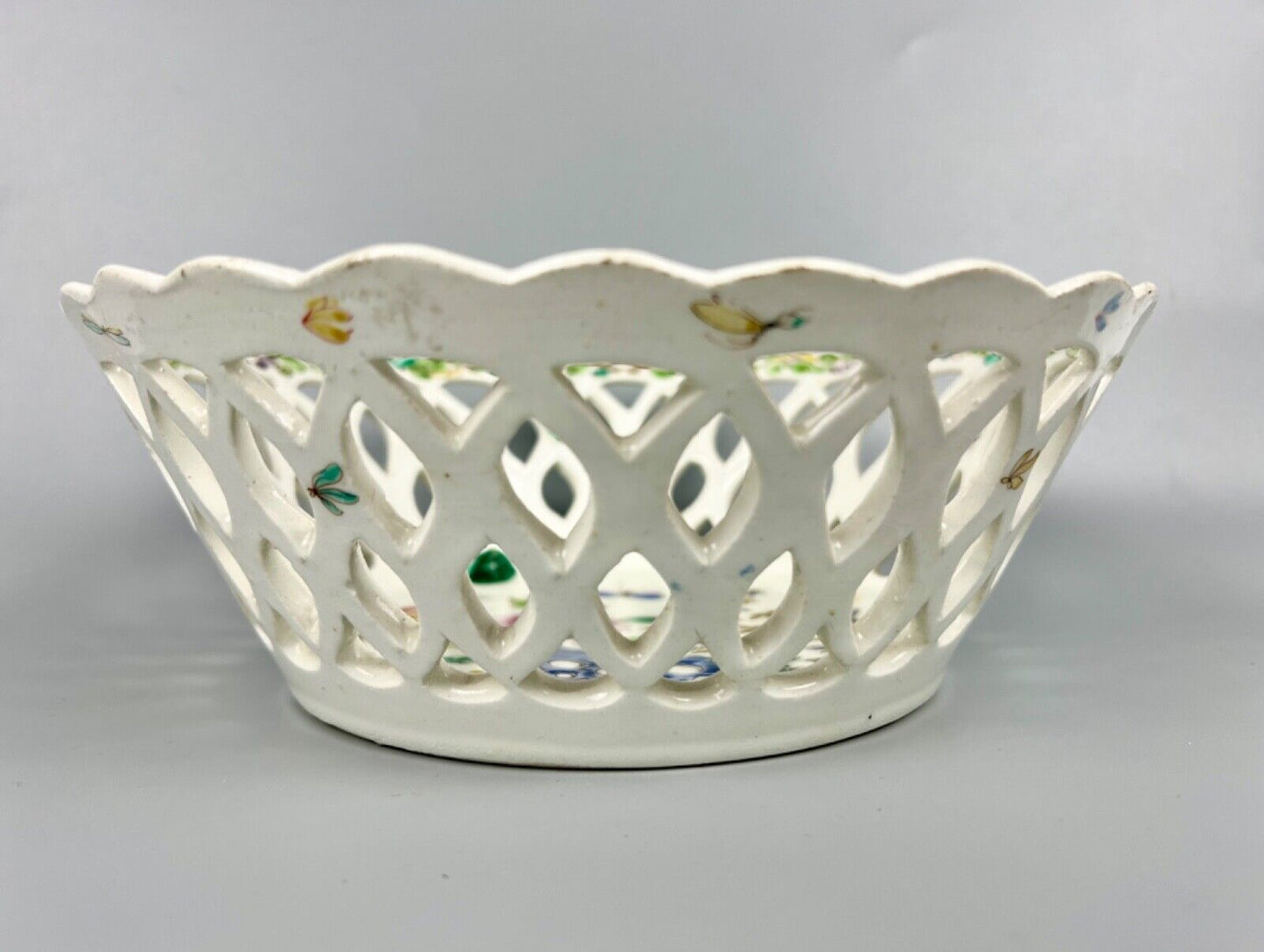 A pair of large Bow porcelain famille rose reticulated baskets c.1752