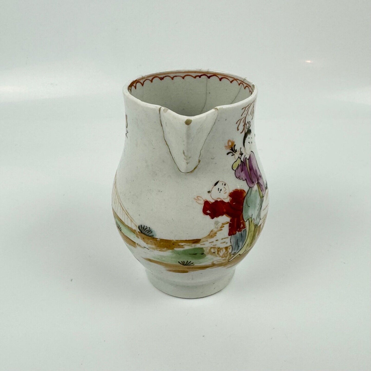 A Lowestoft sparrowbeak creamer c1775 painted with an Oriental figural pattern
