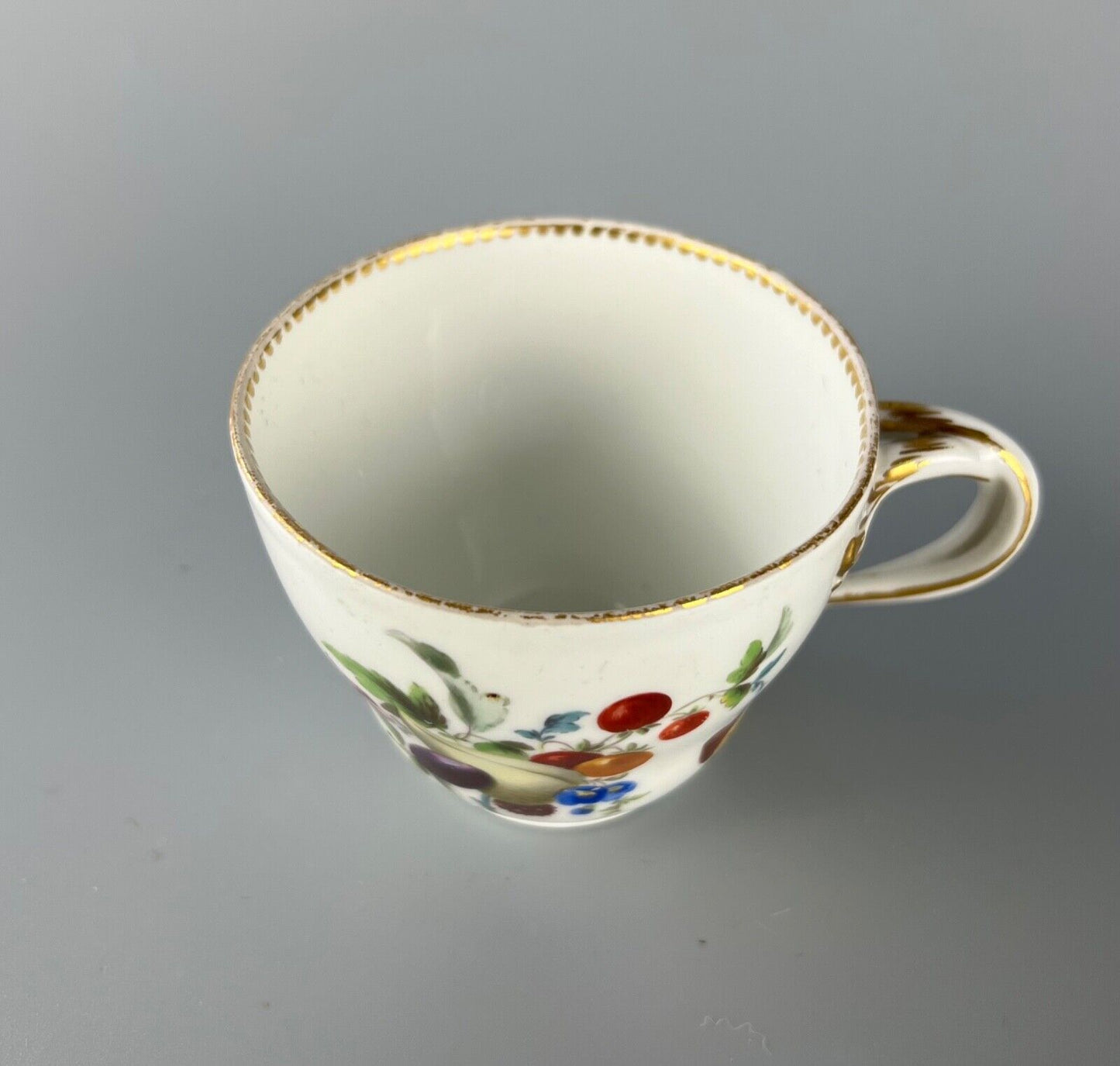 A set of four Meissen Marcolini Period c.1800 bifurcated-handle coffee cups.