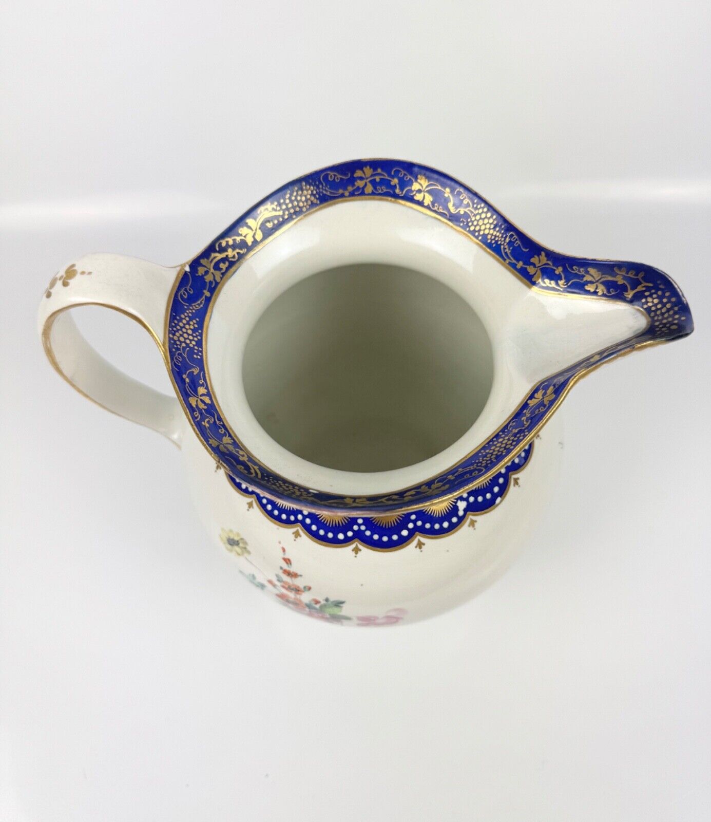 A rare Derby ewer Smith's blue rim and painted with flowers by Withers. c.1780