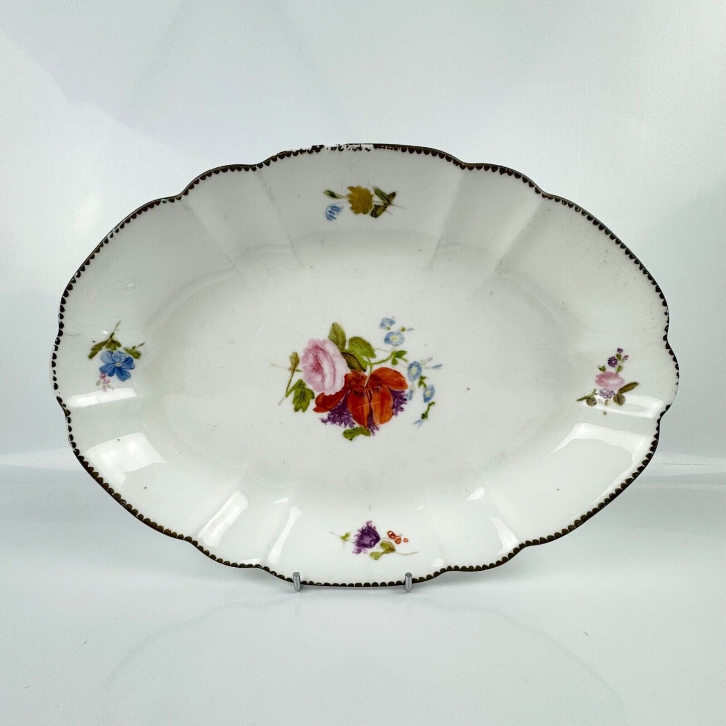 Nantgarw locally decorated lozenge-shaped dish. Impressed "CW" Mark 1810–15