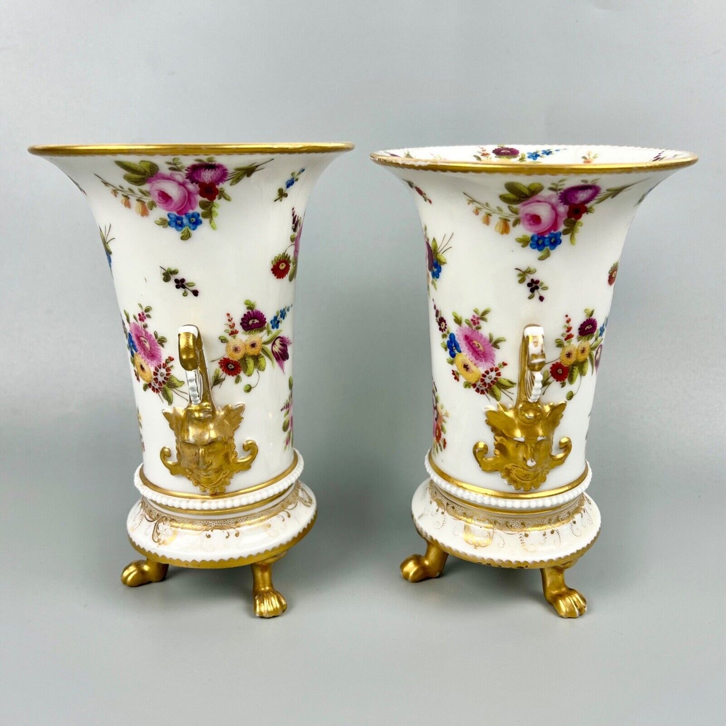 A pair of early 19th century vases in Swansea style c1810