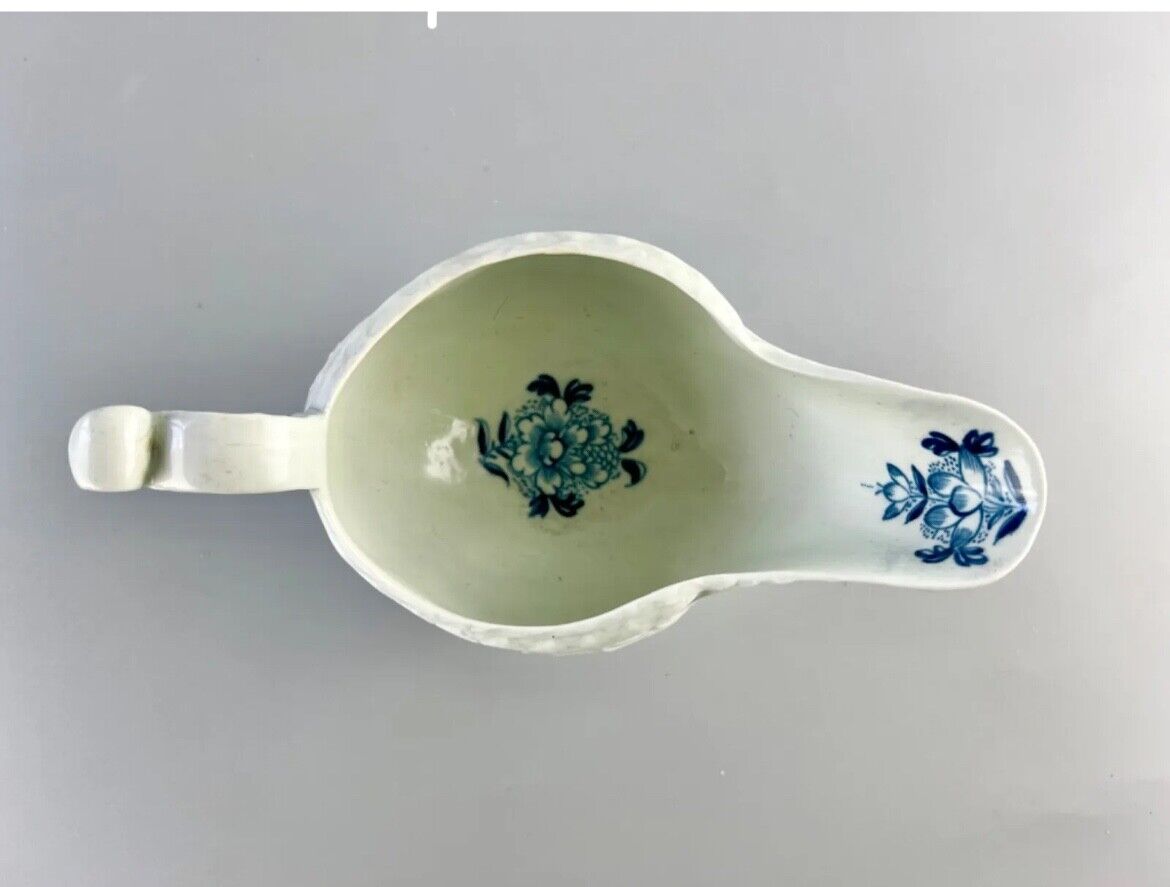 Christian Liverpool porcelain moulded sauceboat with oriental decoration. c.1770