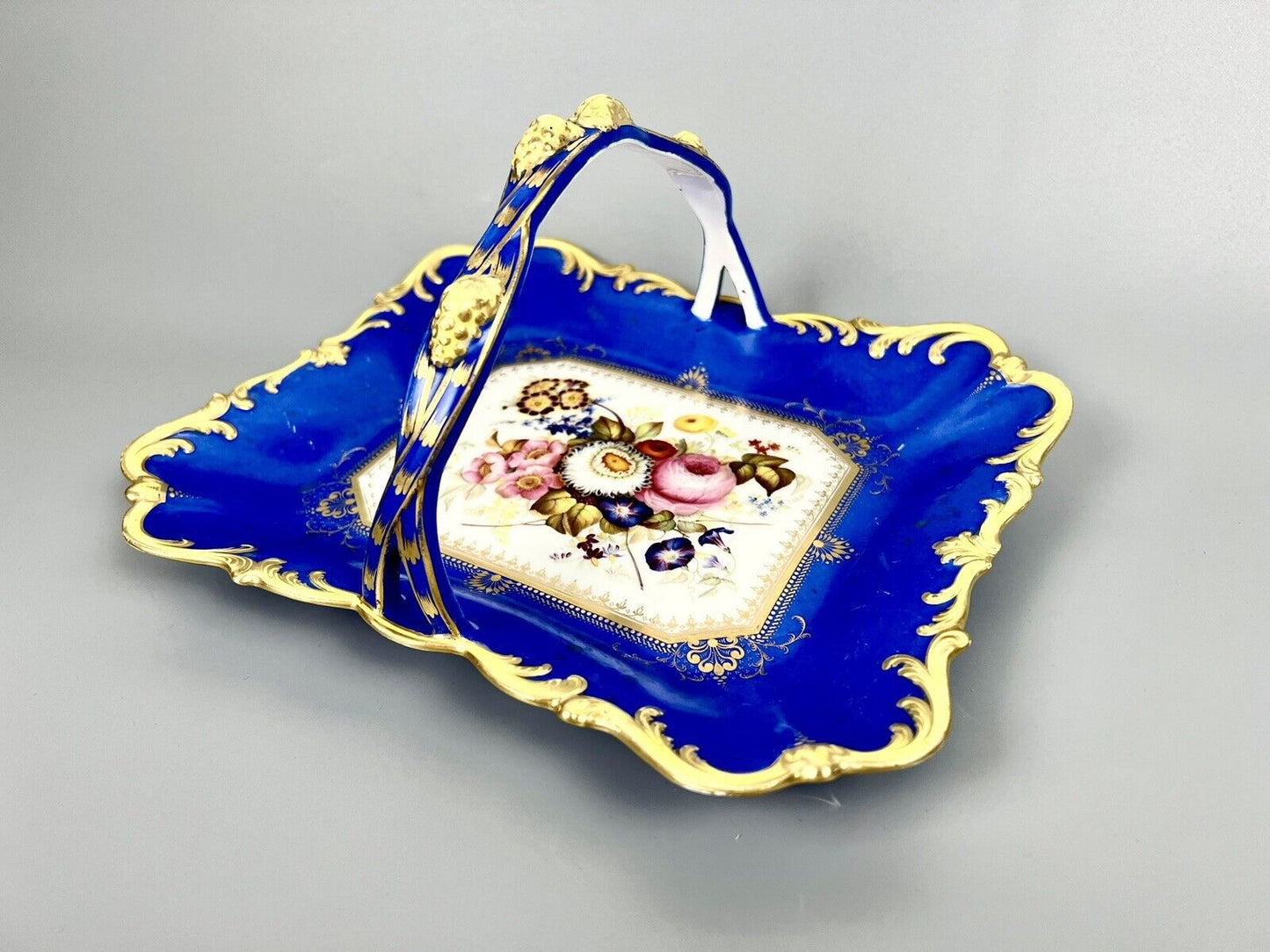 A lovely Samuel Alcock fruit basket finely painted with garden flowers. c.1830