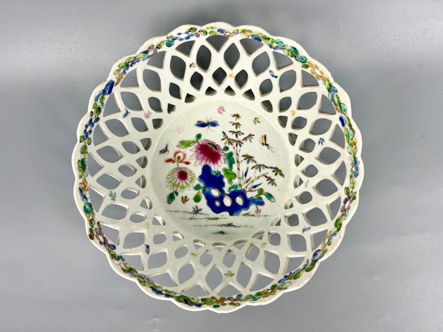 A pair of large Bow porcelain famille rose reticulated baskets c.1752