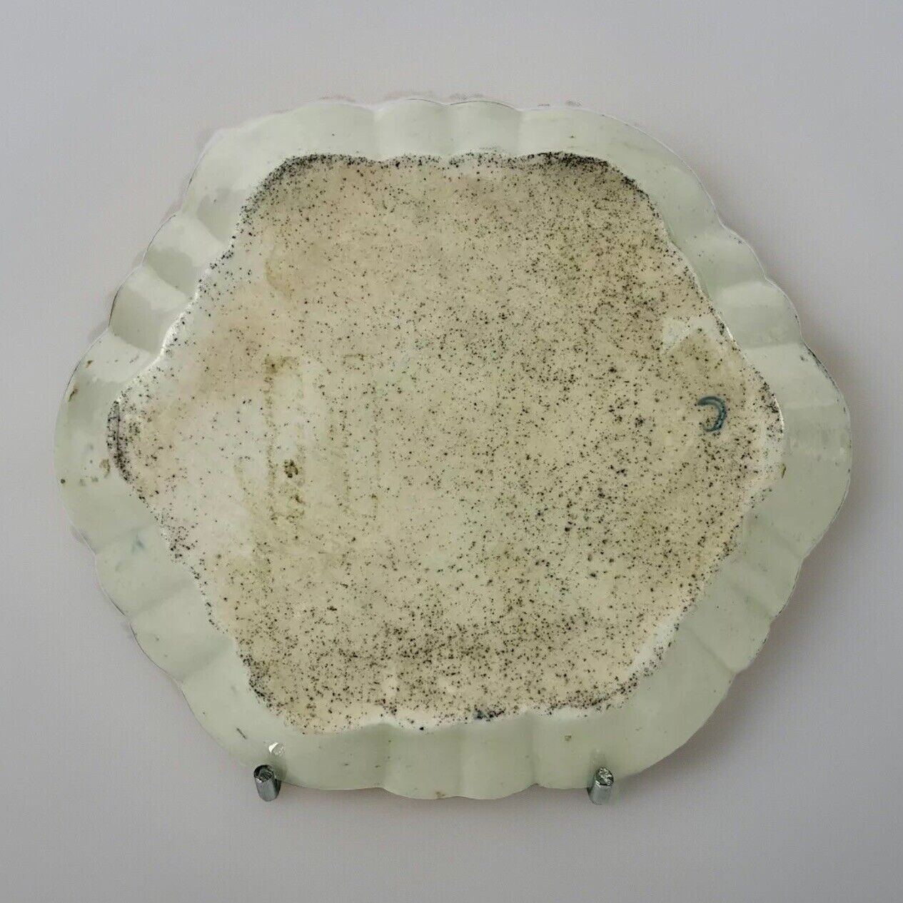 A c1770 later decorated First Period Worcester teapot stand .