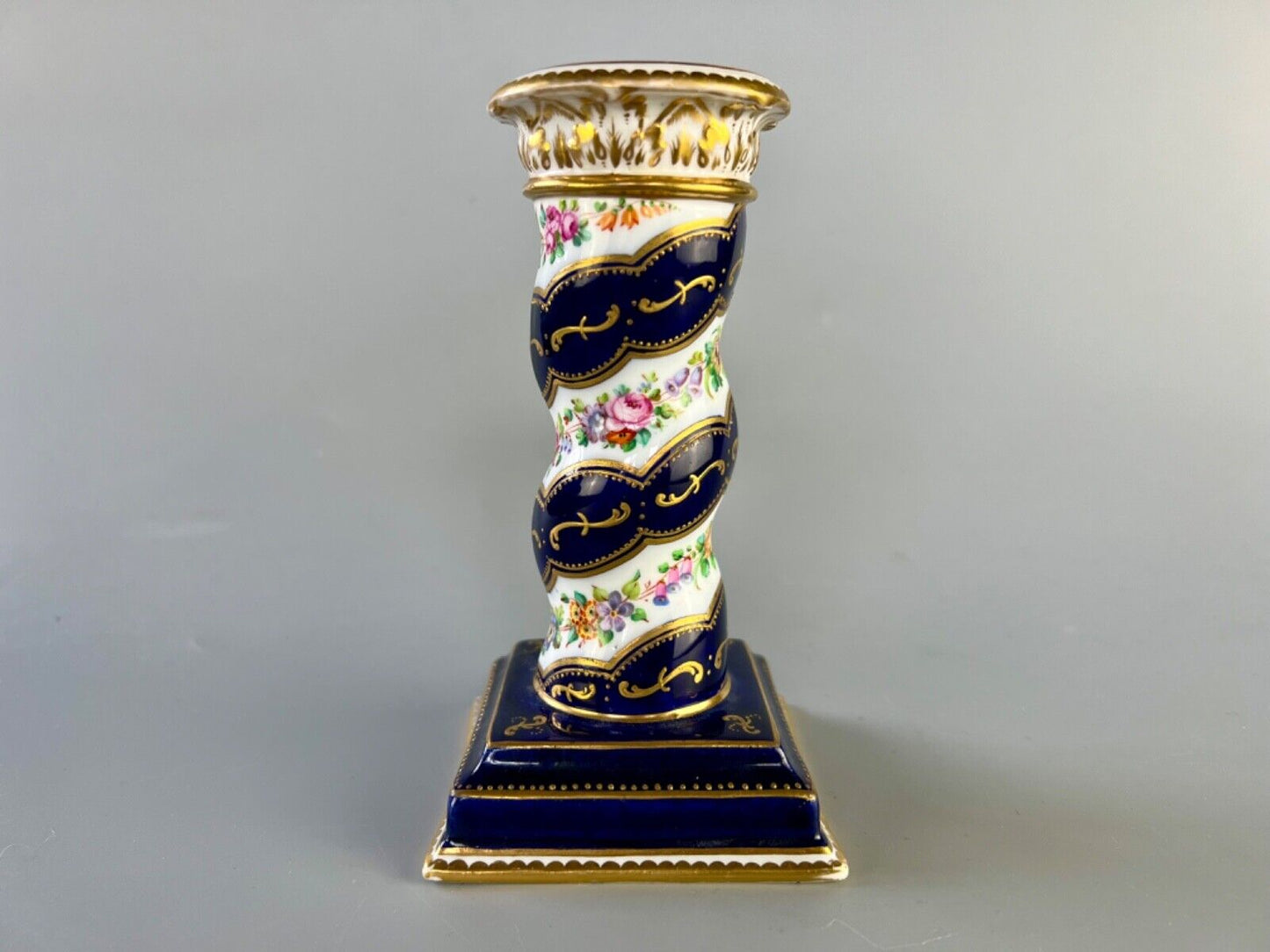 A pair of c 1810-25 Coalport Coalbrookdale spiral-moulded candlesticks.