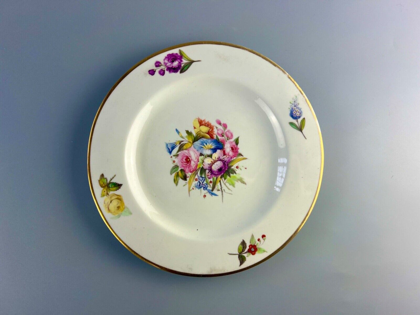 An early 19thc Derby floral-painted (probably by Leonard Lead) plate.