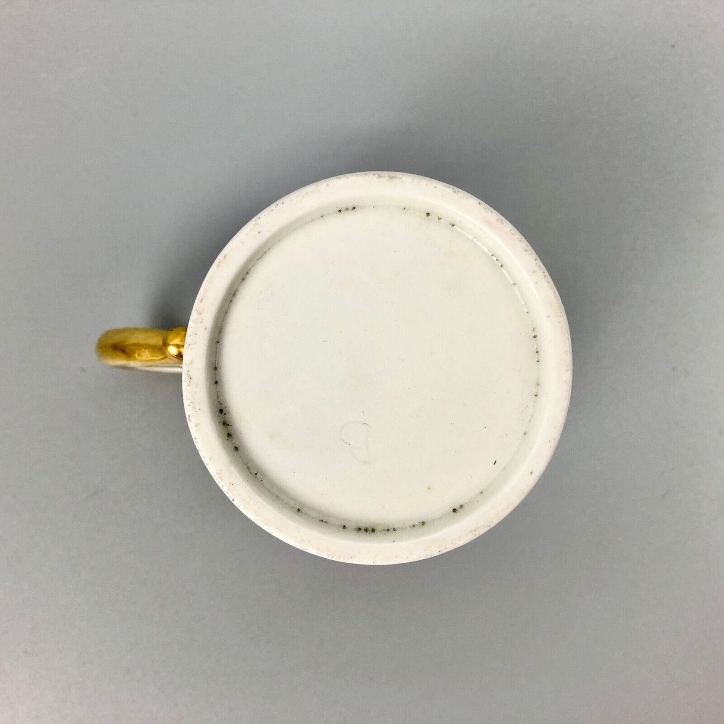 A Barr Worcester coffee can with a floral band on salmon ground c.1795-1805