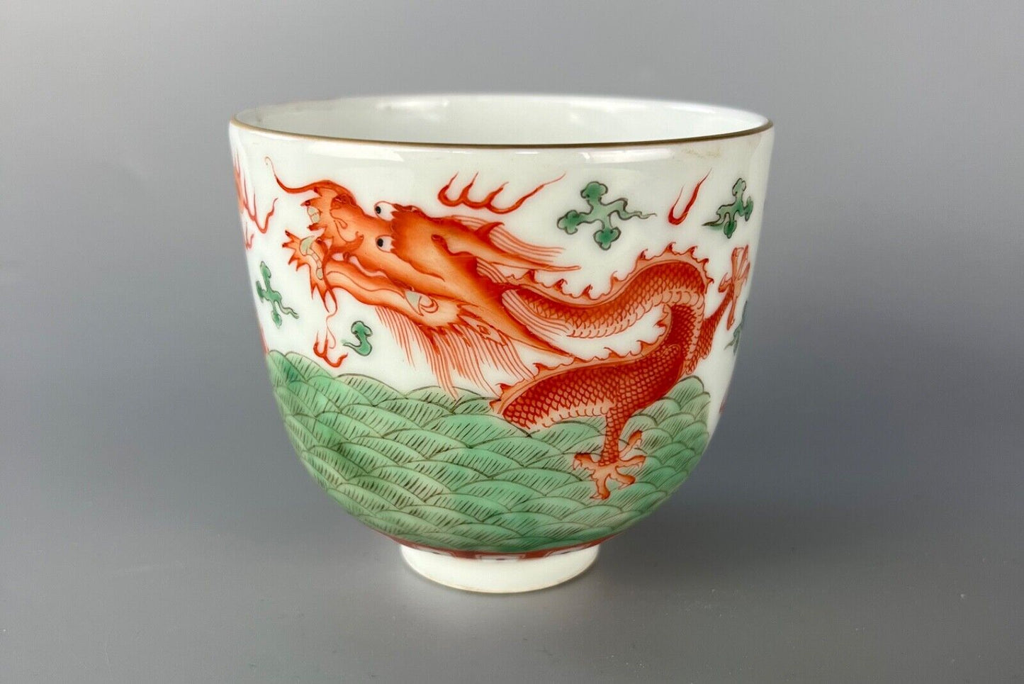 A 20thc Chinese porcelain painted bowl, depicting the dragon & flaming pearl.