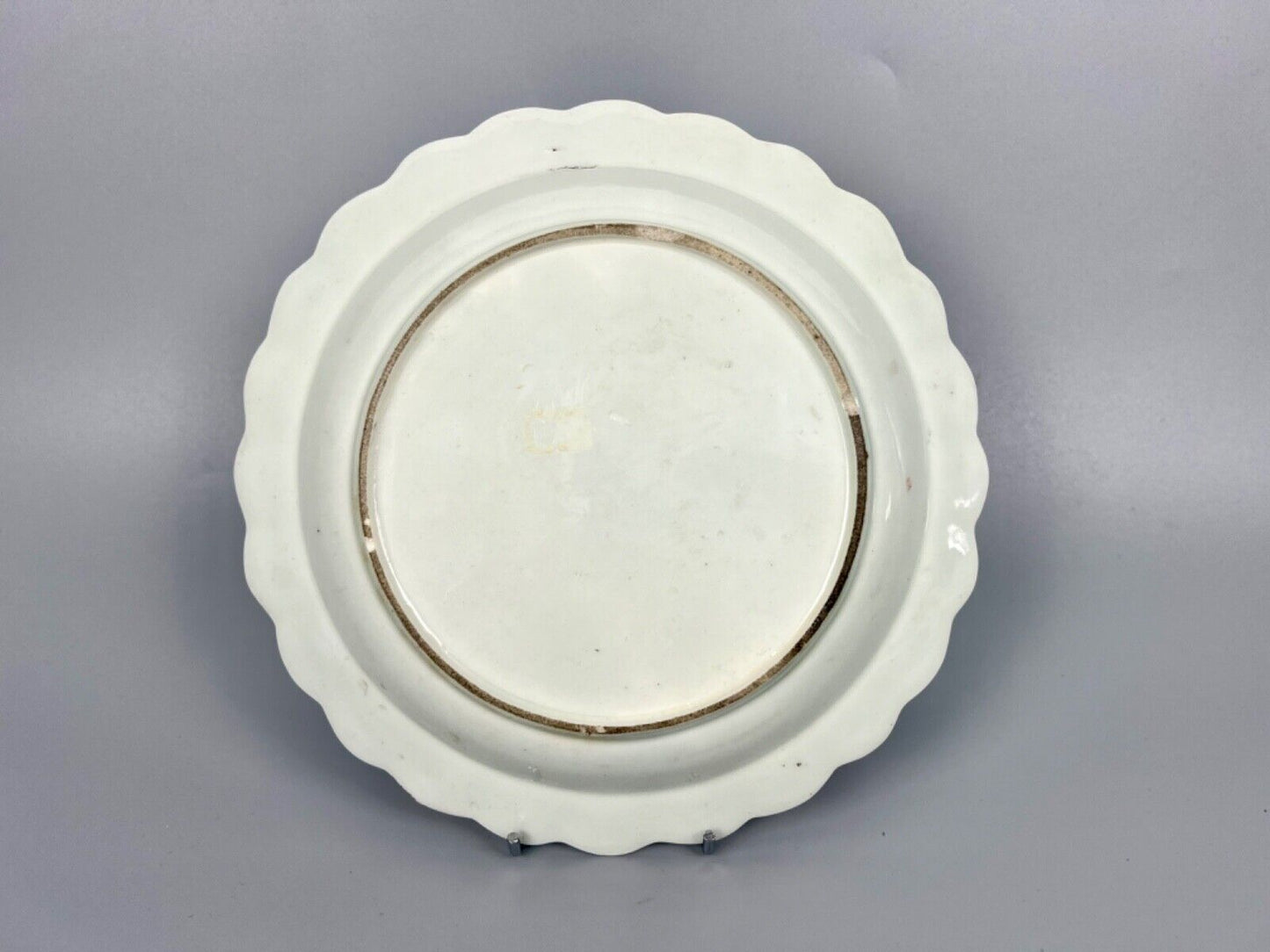 A 1st Period Worcester scalloped dessert plate painted with flowers c.1775