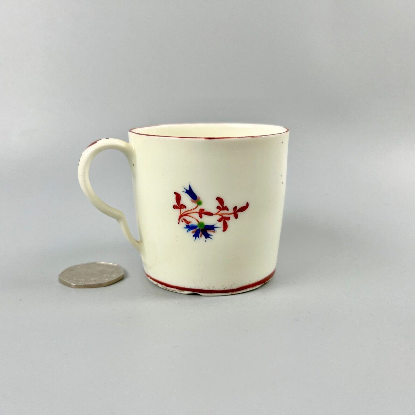 A Pinxton pattern one coffee can painted with Barbeaux Sprigs c1800
