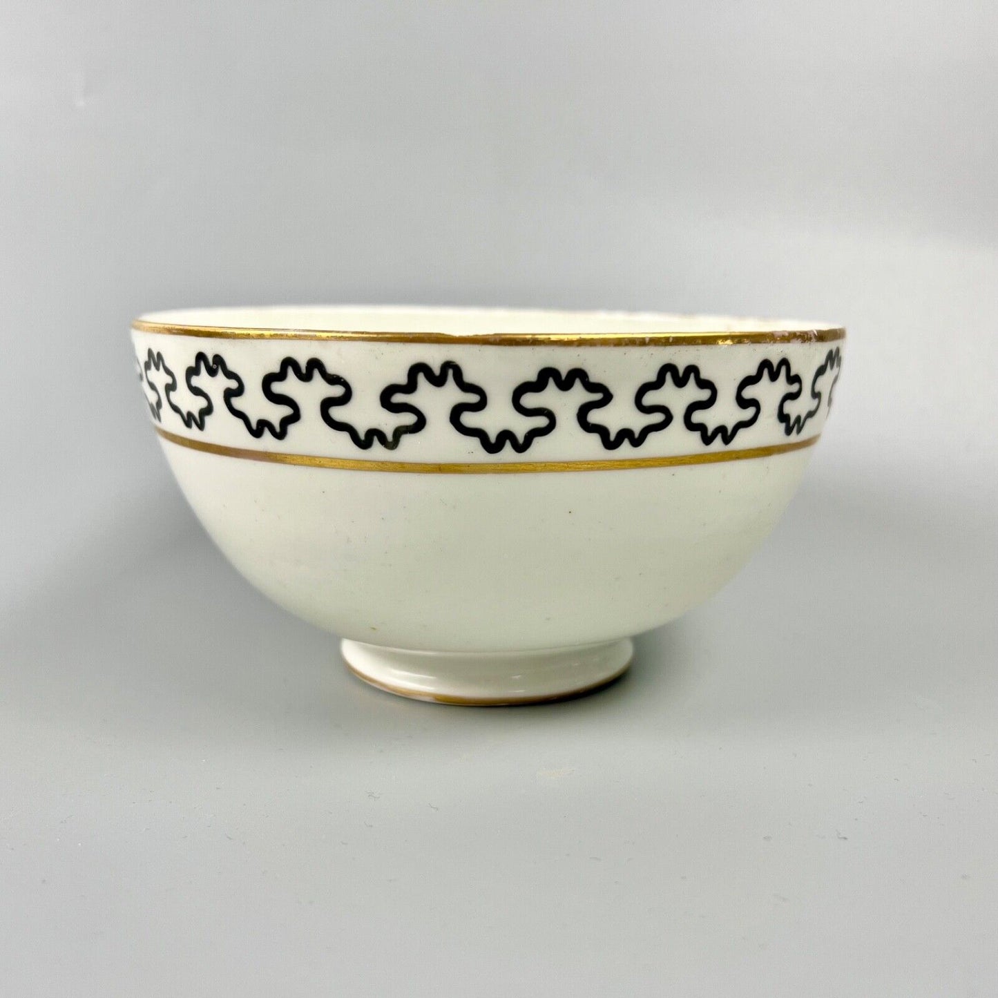 An unrecorded Pinxton slop bowl painted with a meandering black line. c.1810