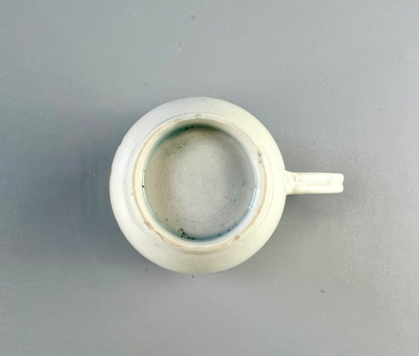 A Worcester polychrome pattern coffee cup with unusual rim decoration c.1770