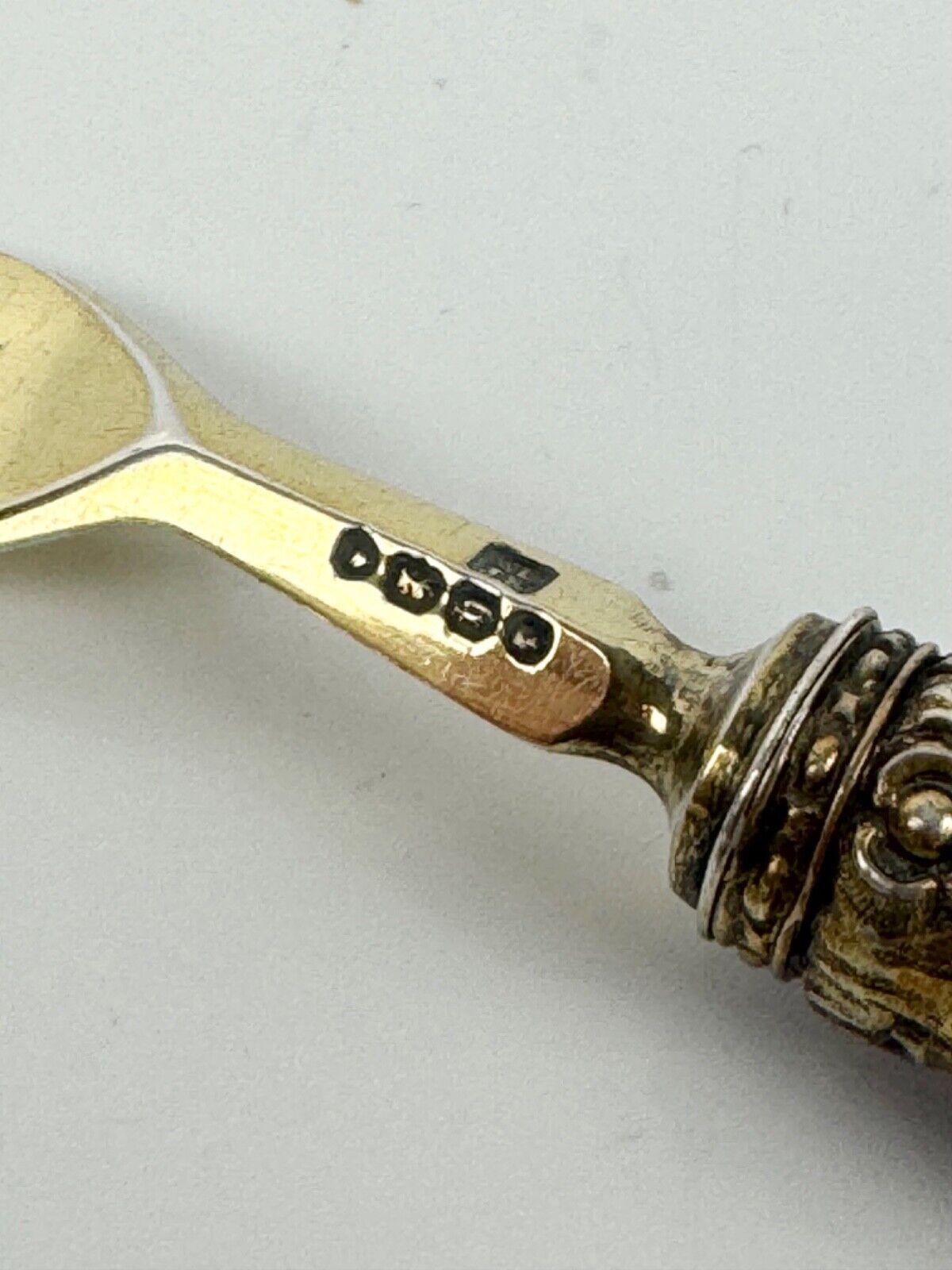A sterling silver-gilt knife & fork set-the silver c.1863, the porcelain c.1760