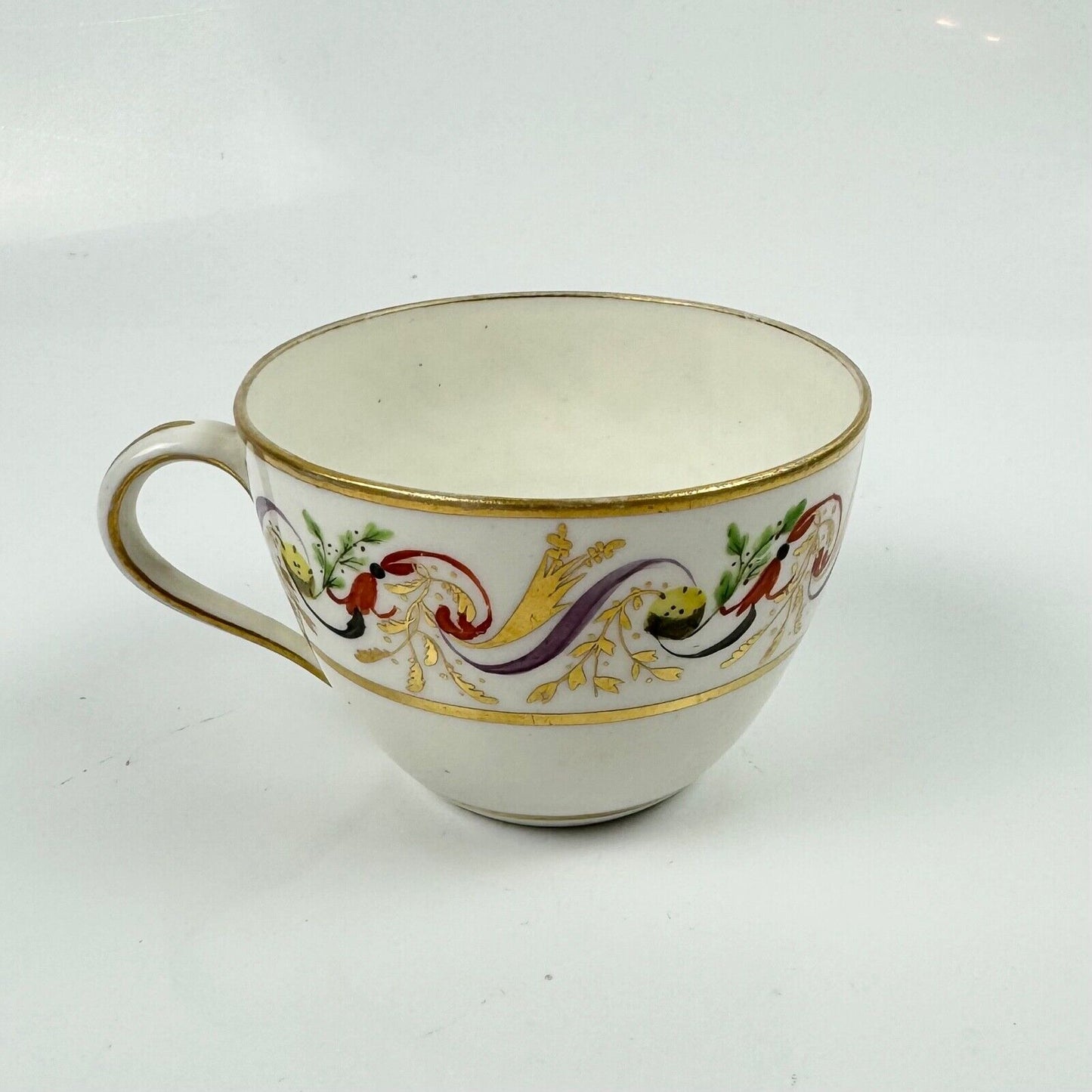 A good Pinxton tea cup and saucer c1796-9 in pattern 301.