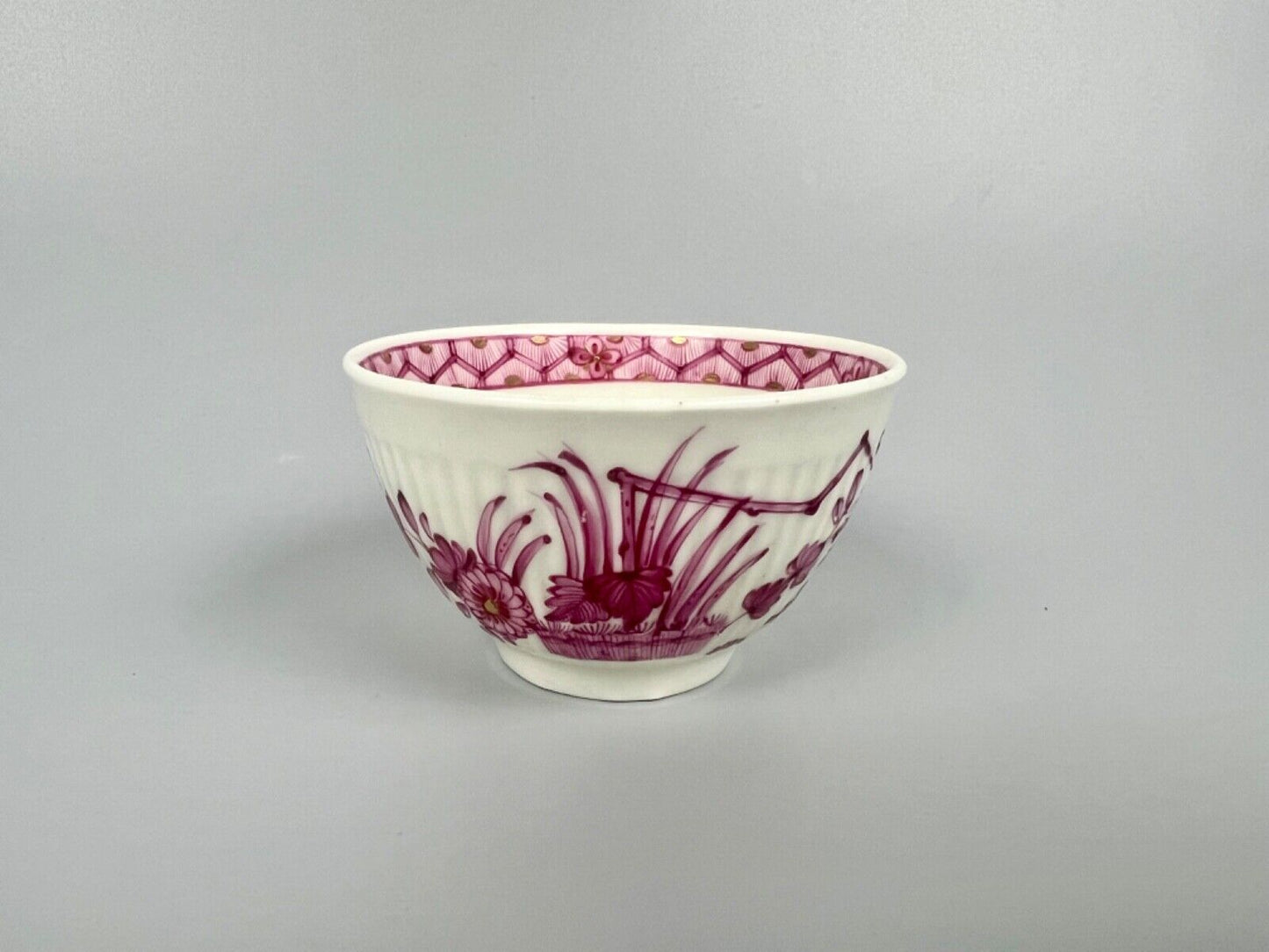 A rare Worcester reeded teacup and saucer painted in Meissen style. c.1772