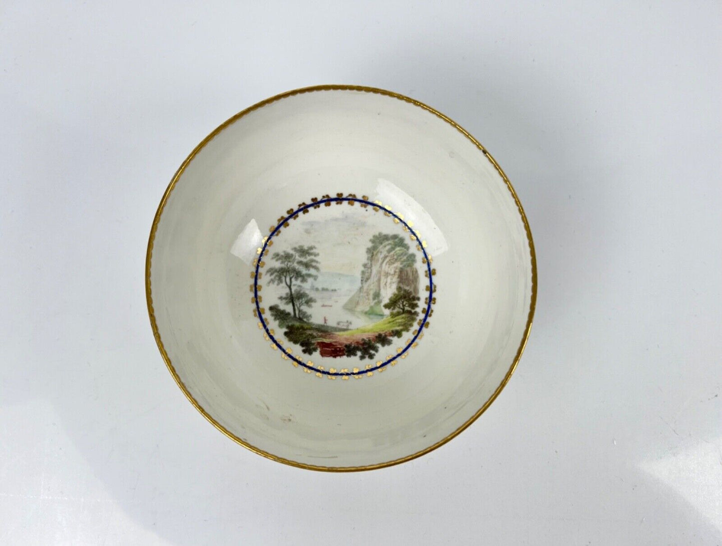 A fine Derby puce bowl in patt 86 with landscape by Zachariah Boreman c.1785-96